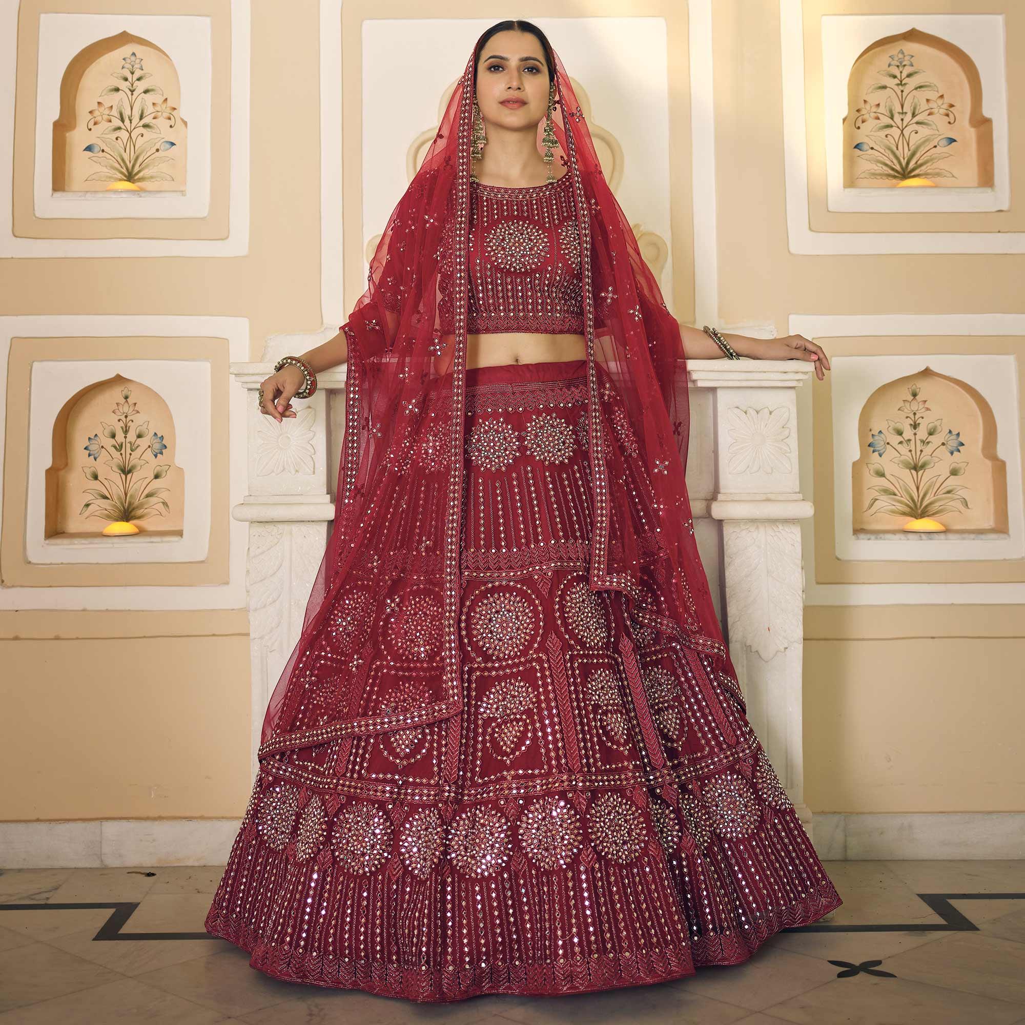 Maroon Wedding Wear Embellished Netted Lehenga Choli - Peachmode
