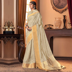 Mesmerising Cream Colored Festive Wear Printed And Woven Border Silk Saree - Peachmode