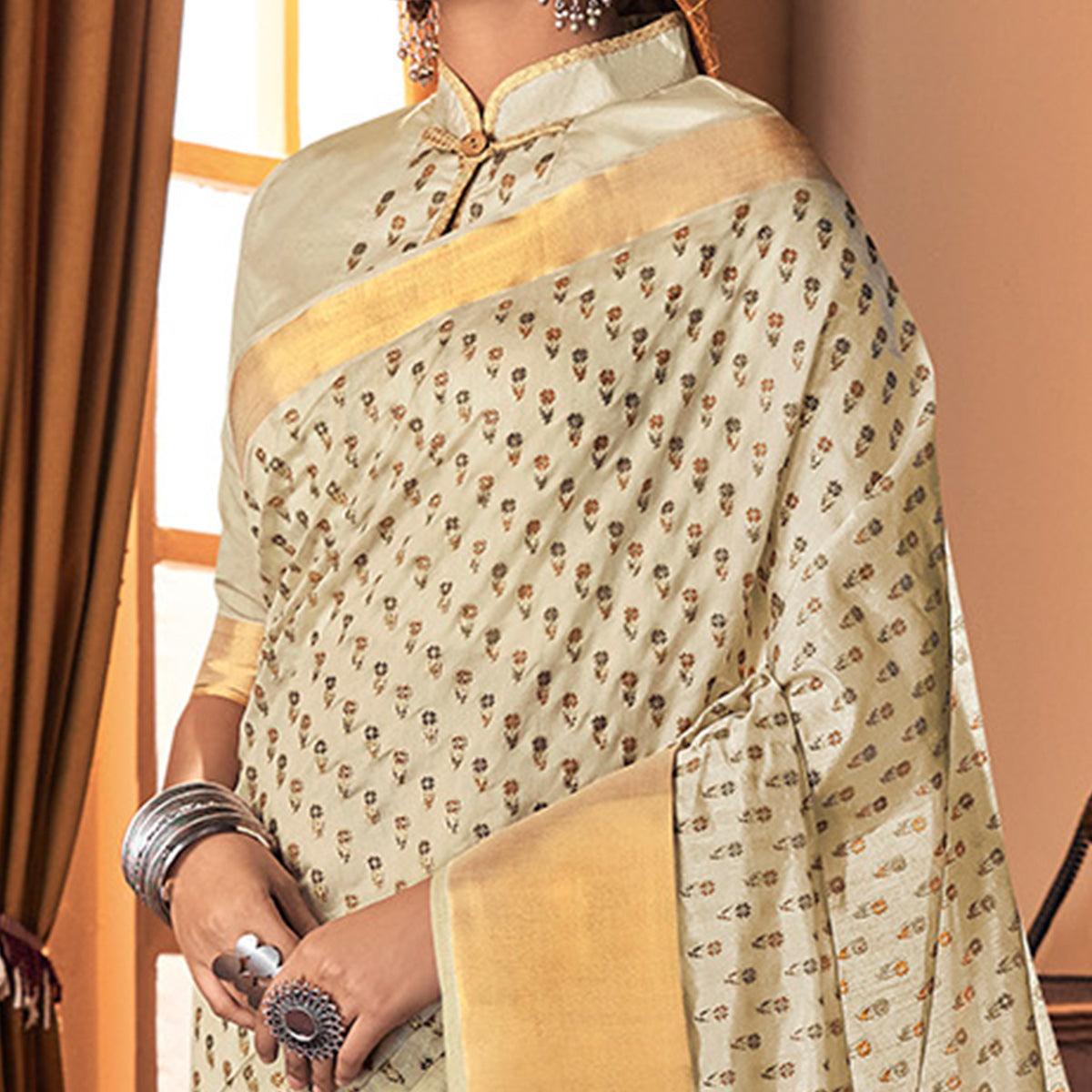 Mesmerising Cream Colored Festive Wear Printed And Woven Border Silk Saree - Peachmode