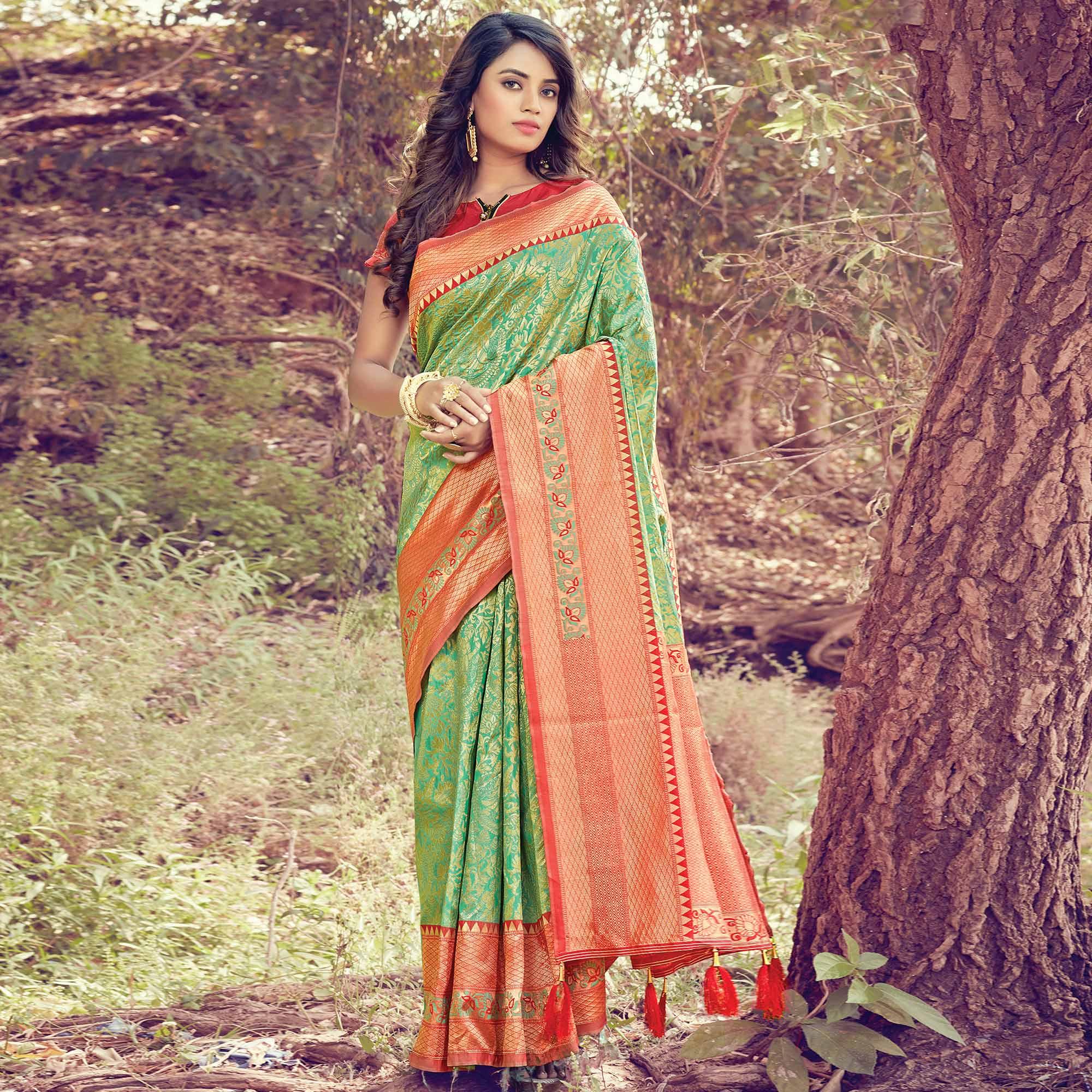 Mesmerising Green Colored Festive Wear Woven Silk Saree - Peachmode