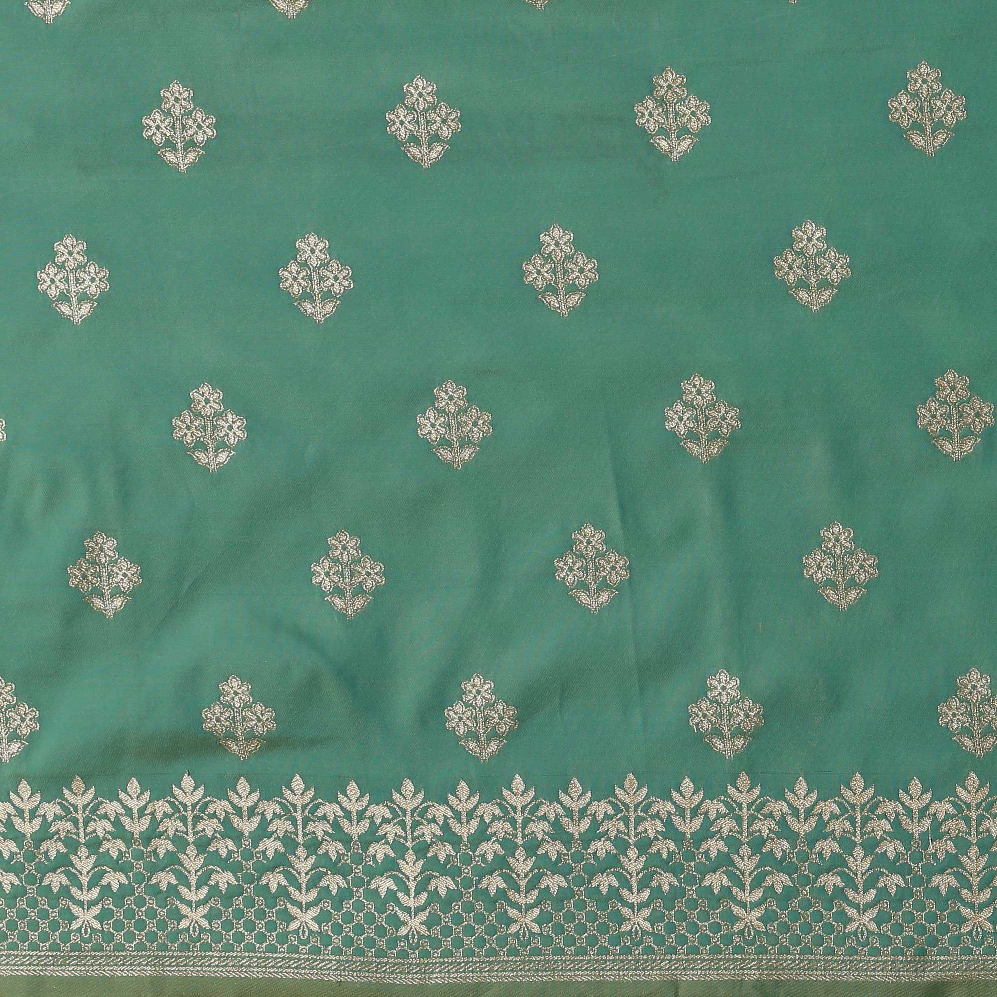 Mesmerising Sea Green Colored Festive Wear Silk Blend Woven Floral Saree With Tassels - Peachmode