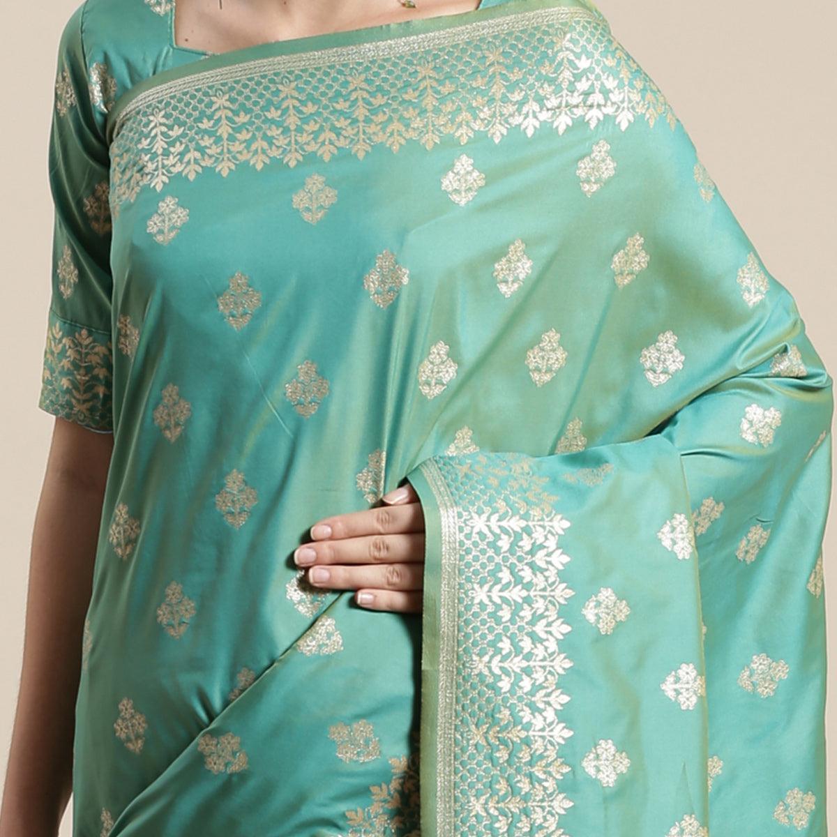 Mesmerising Sea Green Colored Festive Wear Silk Blend Woven Floral Saree With Tassels - Peachmode
