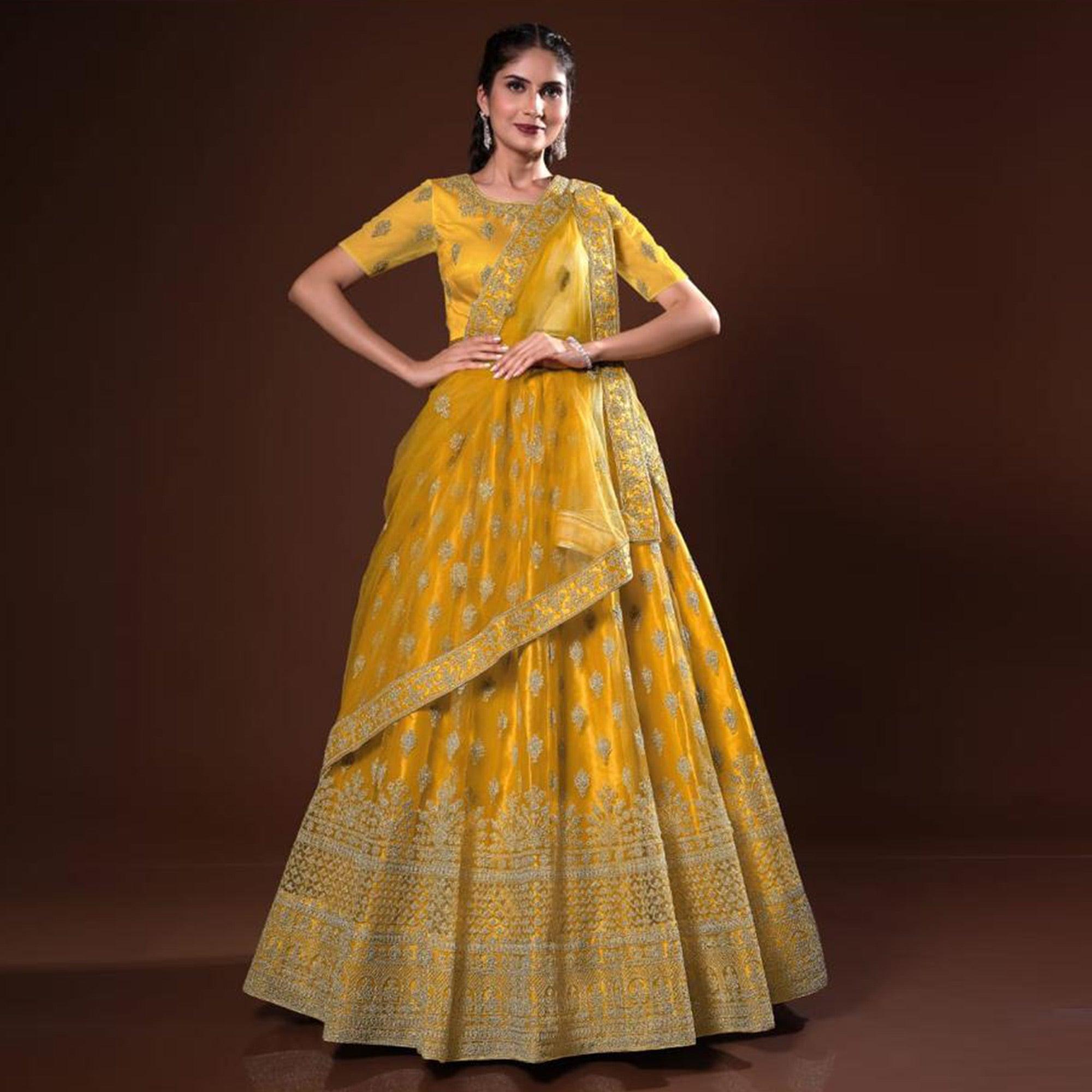 Mustard Embroidered Net Lehenga Choli - Peachmode