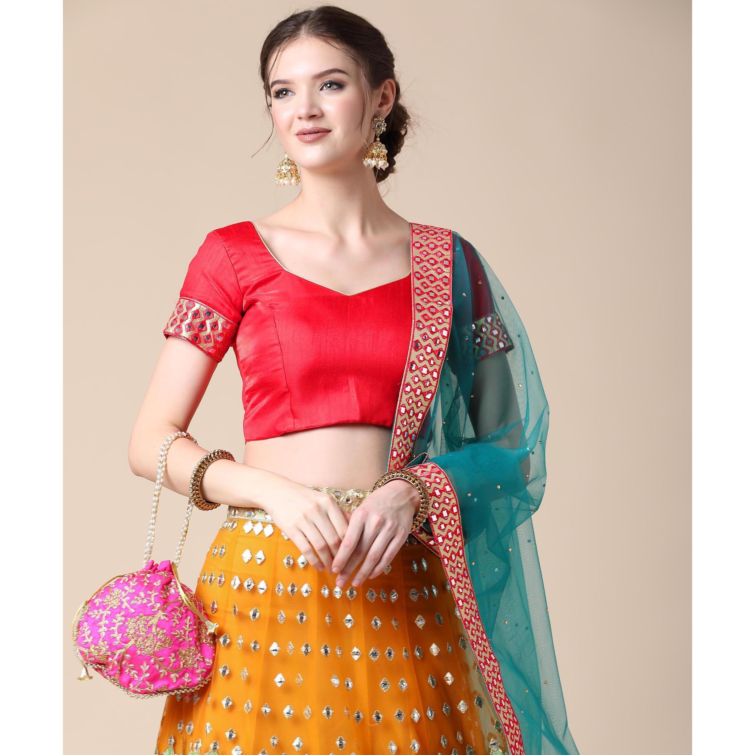 Mustard Partywear Embroidered & Mirror Work Heavy Soft Net Lehenga - Peachmode