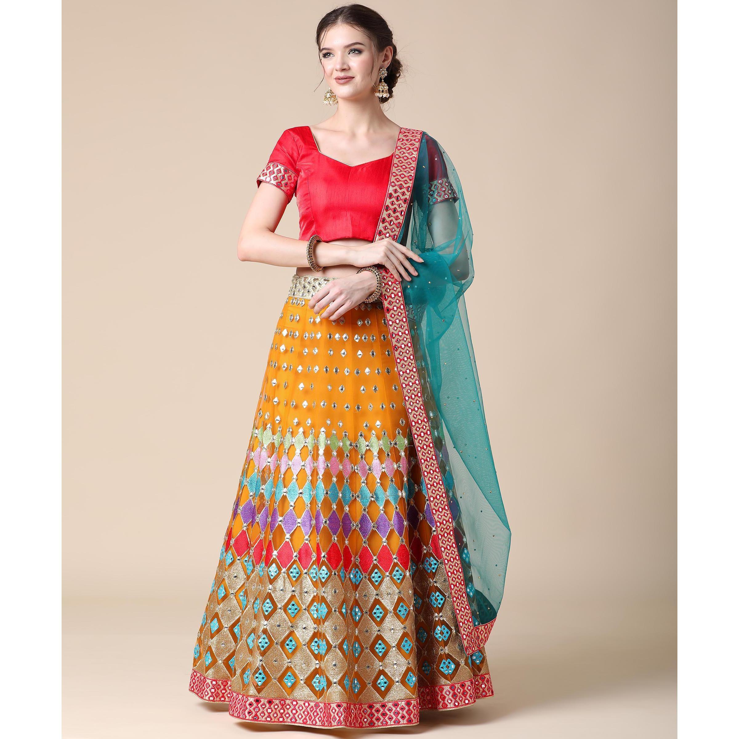 Mustard Partywear Embroidered & Mirror Work Heavy Soft Net Lehenga - Peachmode