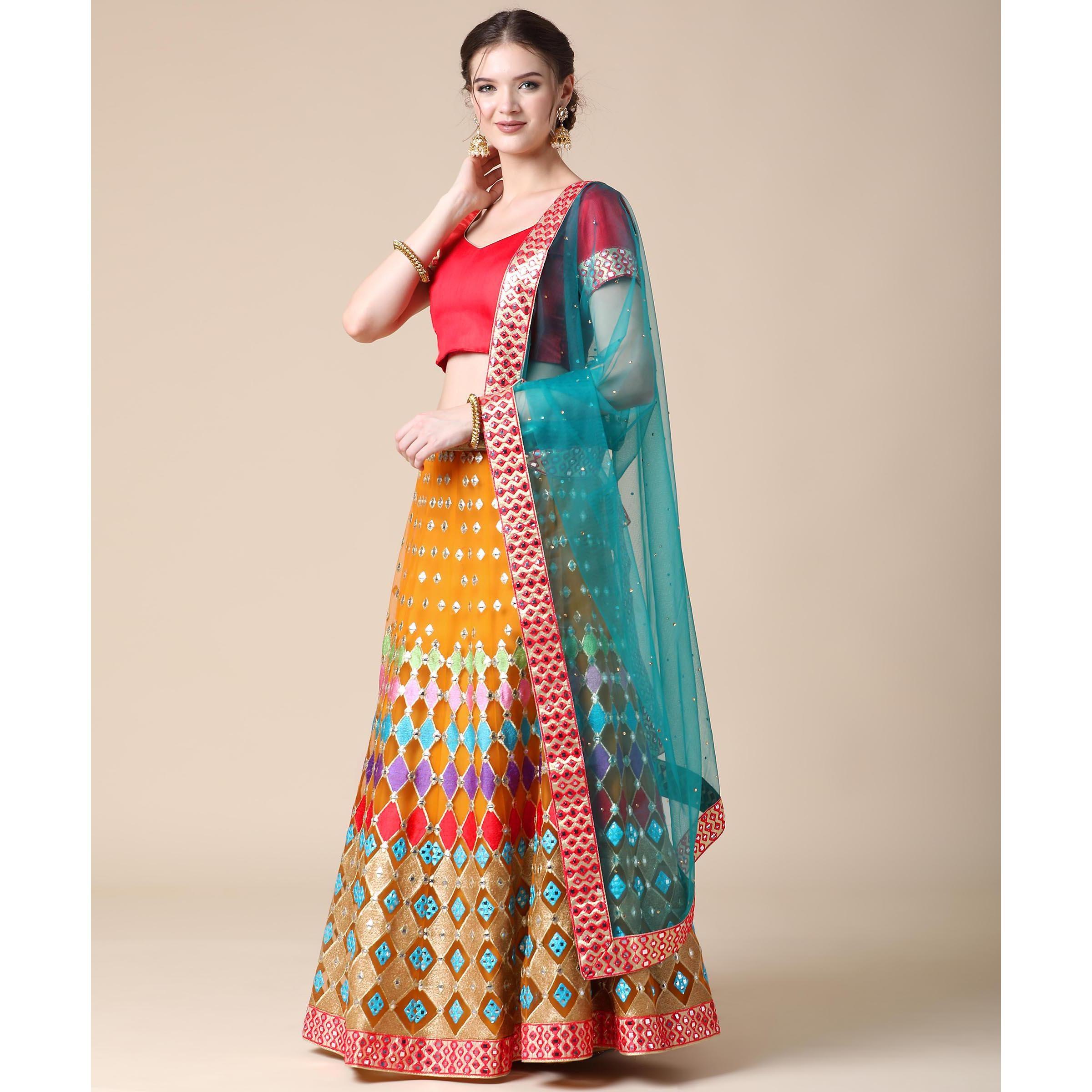 Mustard Partywear Embroidered & Mirror Work Heavy Soft Net Lehenga - Peachmode