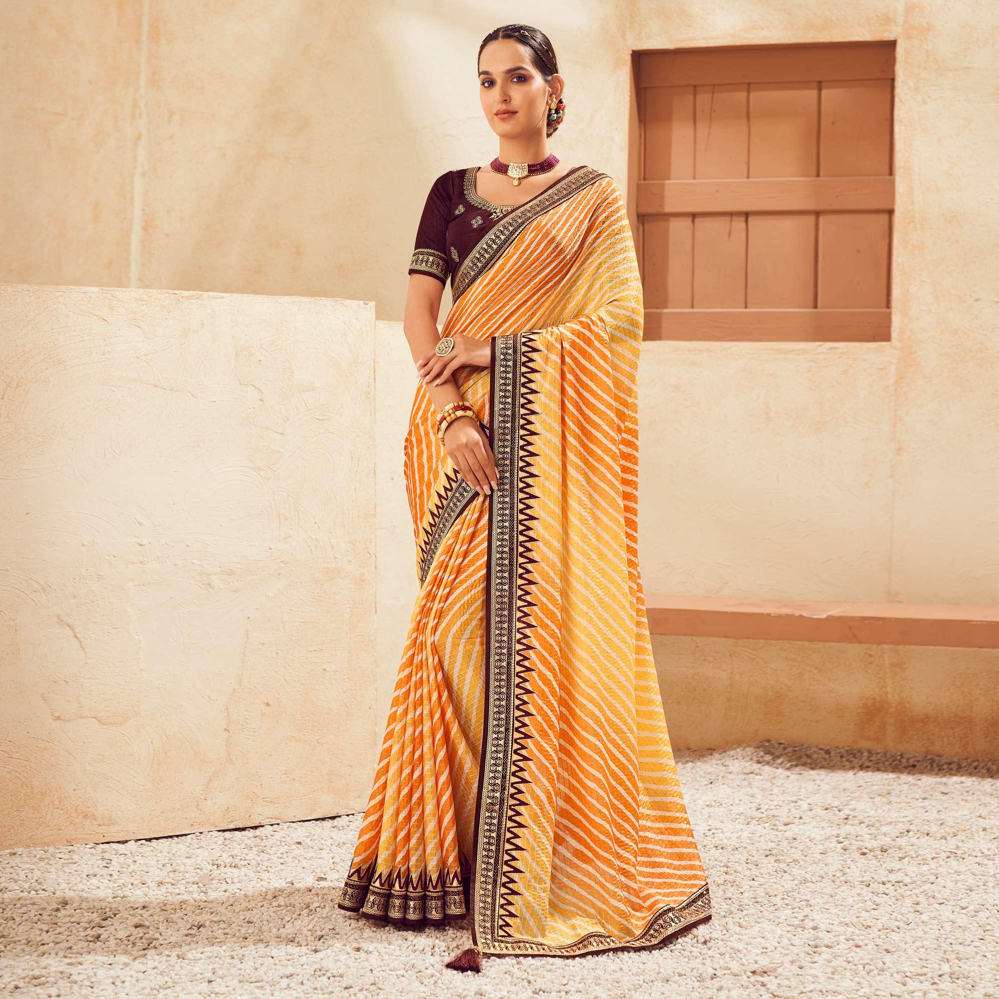 Mustard Printed With Embellished Chiffon Saree With Tassels - Peachmode