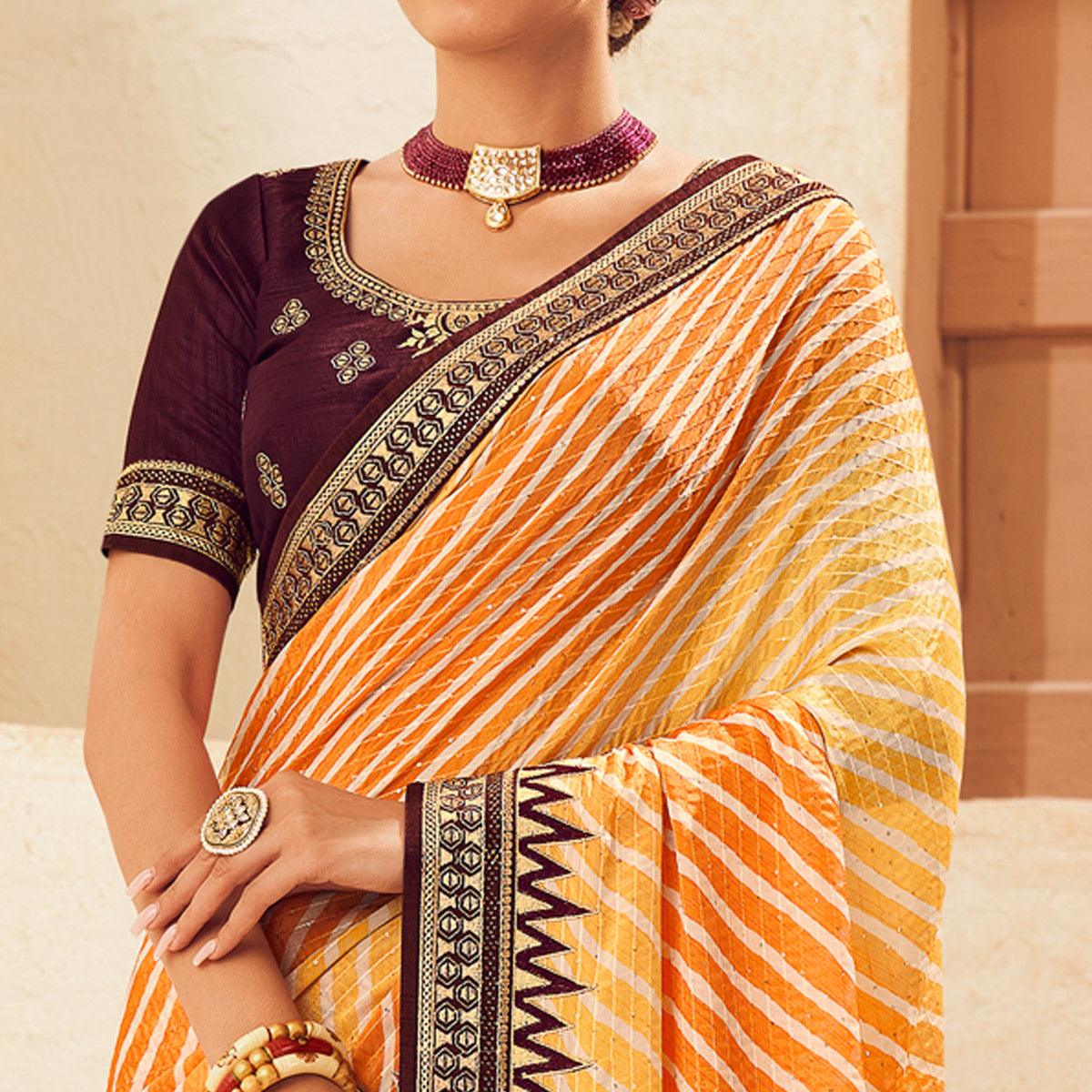 Mustard Printed With Embellished Chiffon Saree With Tassels - Peachmode