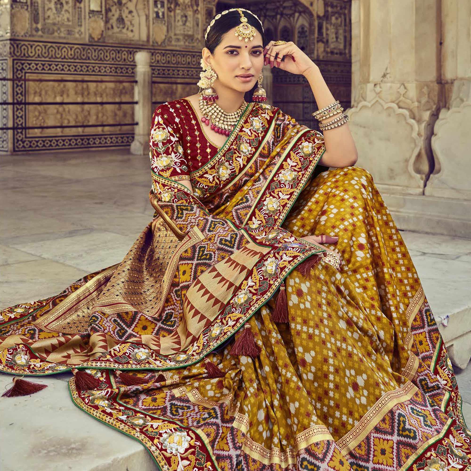 Mustard Wedding Wear Resham With Embellished Silk Bhandhani Patola Saree - Peachmode