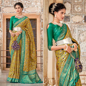 Mustard Woven Art Silk Patola Saree With Tassels - Peachmode