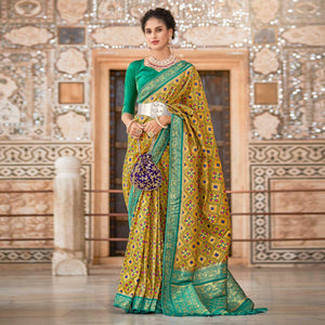 Mustard Woven Art Silk Patola Saree With Tassels - Peachmode