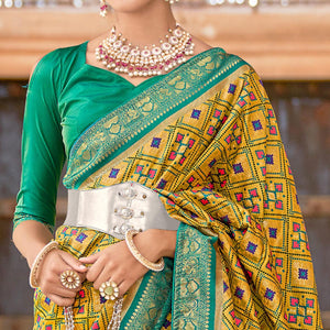 Mustard Woven Art Silk Patola Saree With Tassels - Peachmode