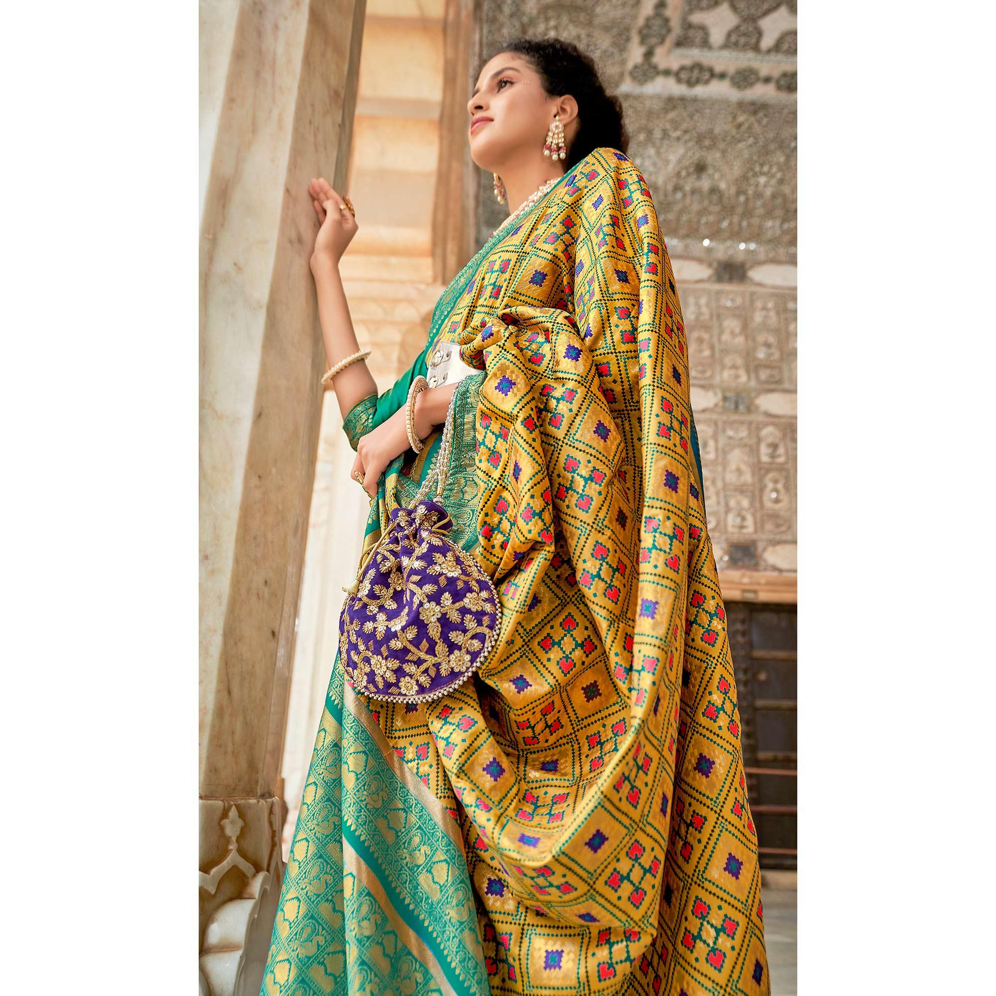 Mustard Woven Art Silk Patola Saree With Tassels - Peachmode