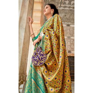 Mustard Woven Art Silk Patola Saree With Tassels - Peachmode