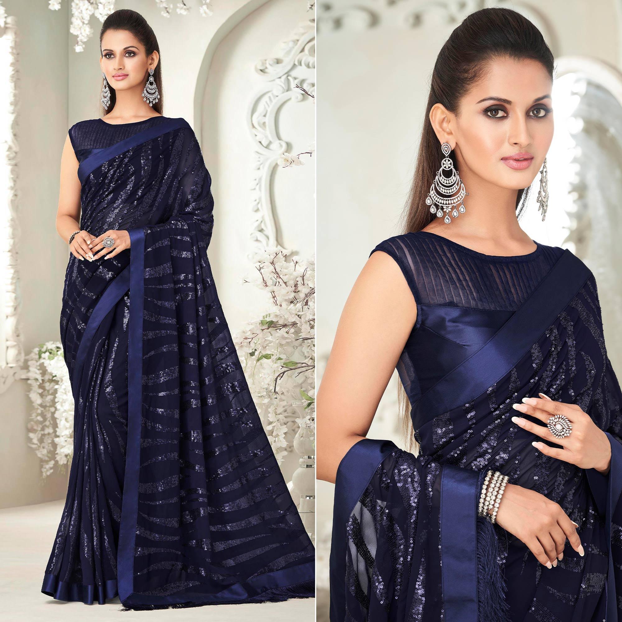 Navy Blue Sequence Embroidered Georgette Saree With Tassels - Peachmode