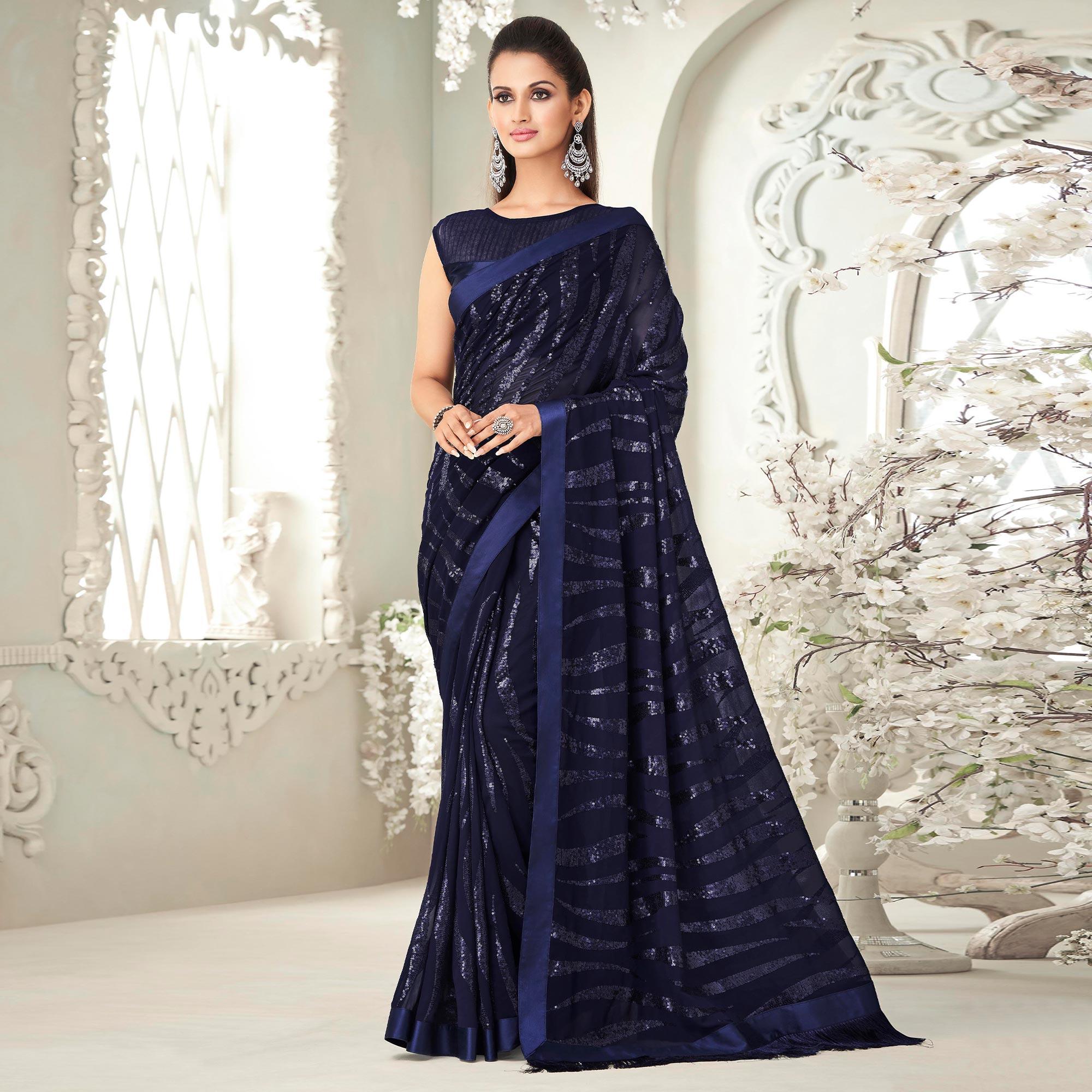 Navy Blue Sequence Embroidered Georgette Saree With Tassels - Peachmode