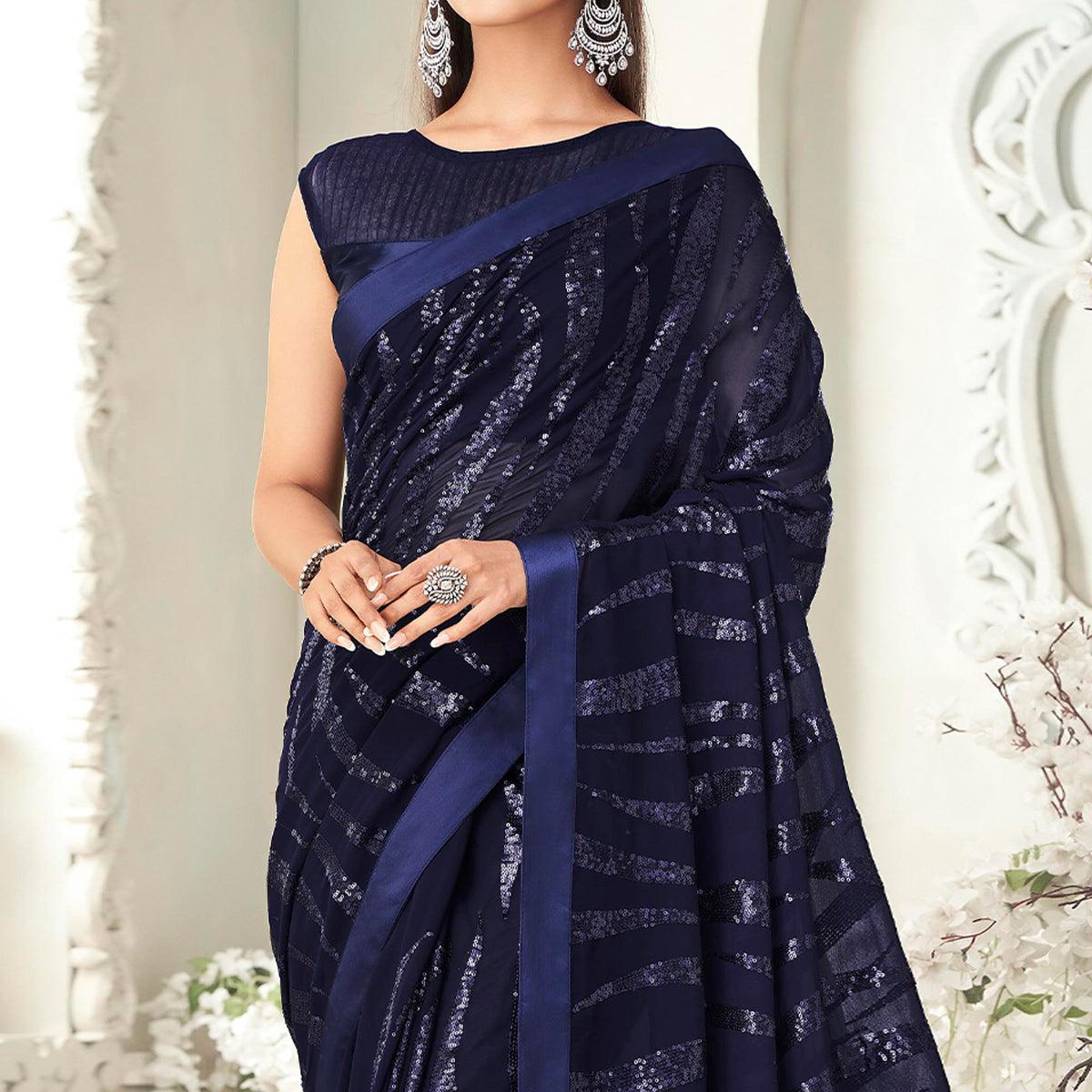 Navy Blue Sequence Embroidered Georgette Saree With Tassels - Peachmode