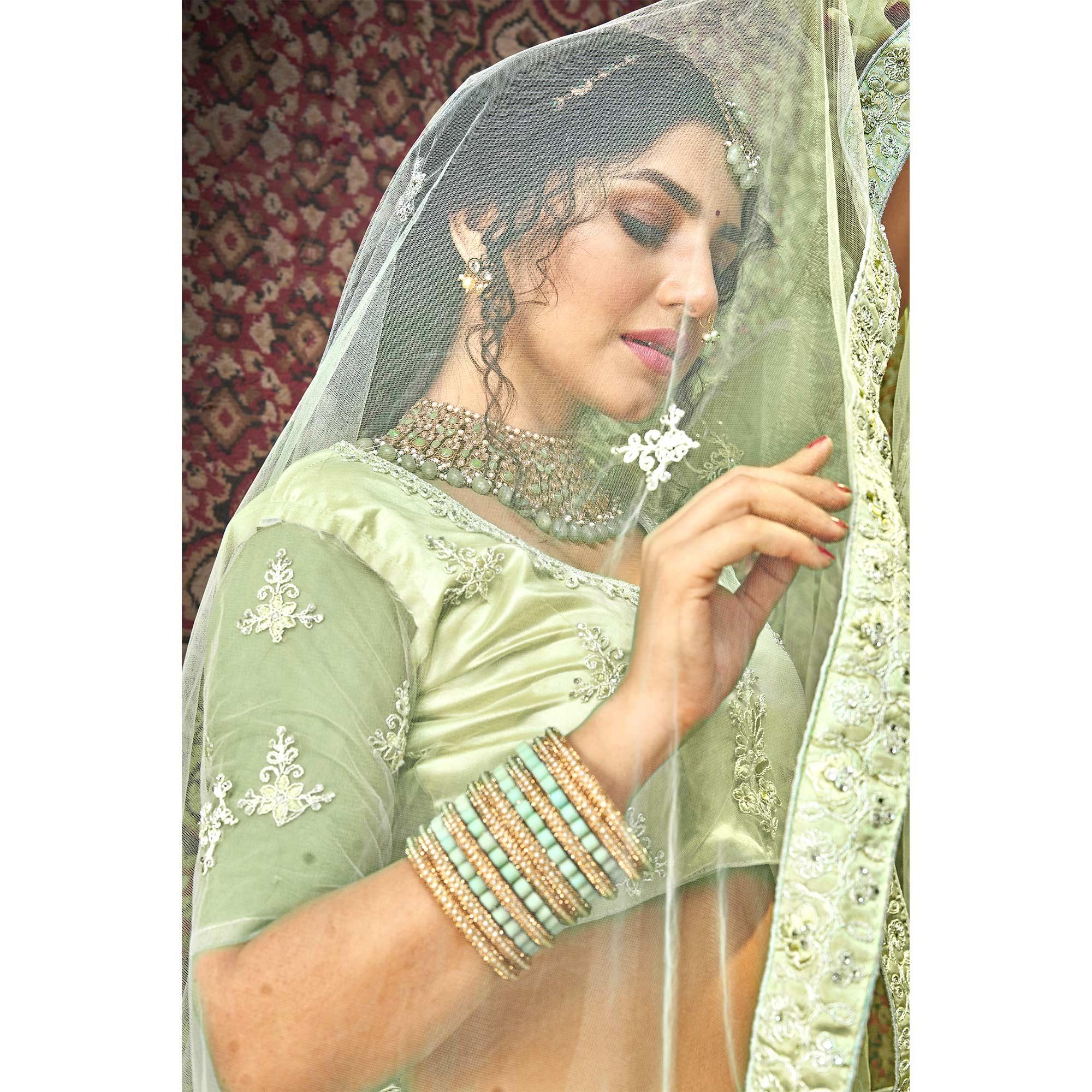 Olive Green Partywear Multi Sequence Embroidered Net Lehenga Choli - Peachmode
