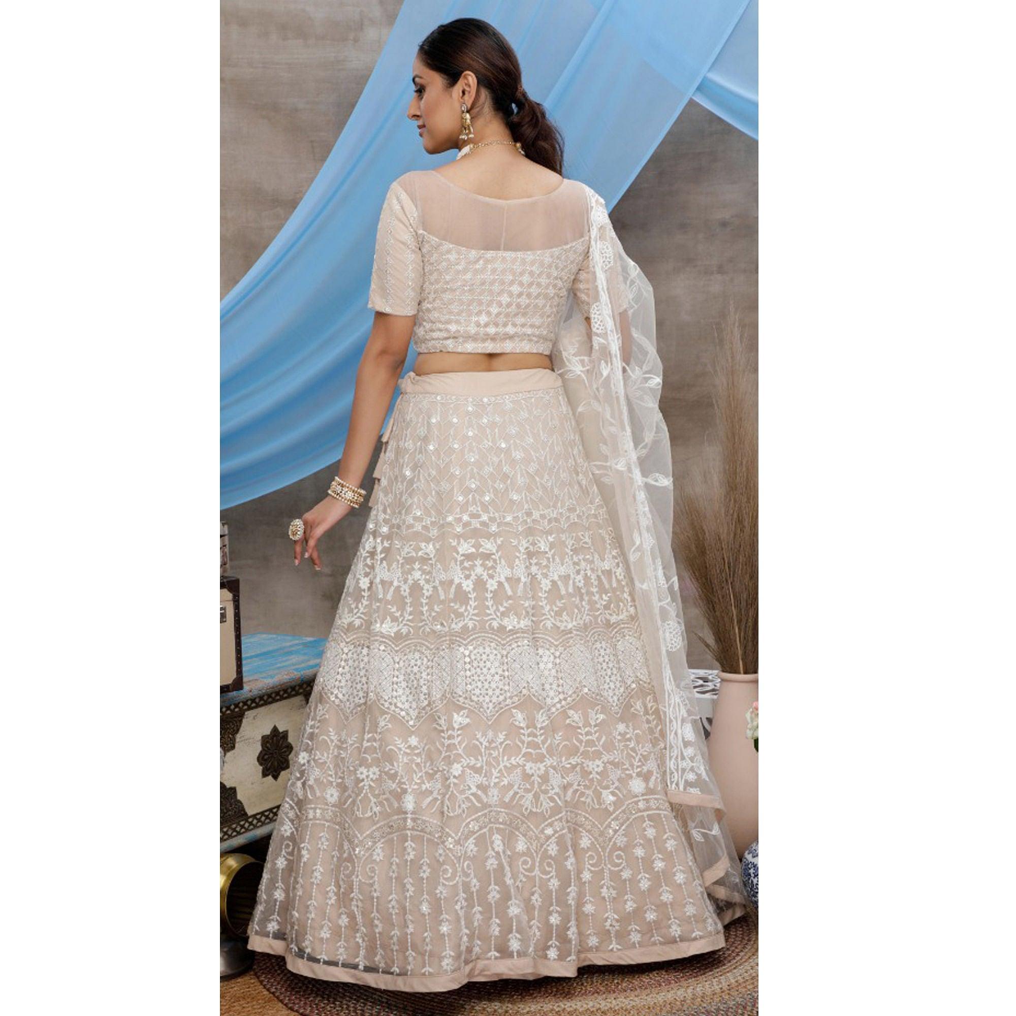 Opulent Beige Colored Party Wear Embroidered Net Lehenga Choli - Peachmode