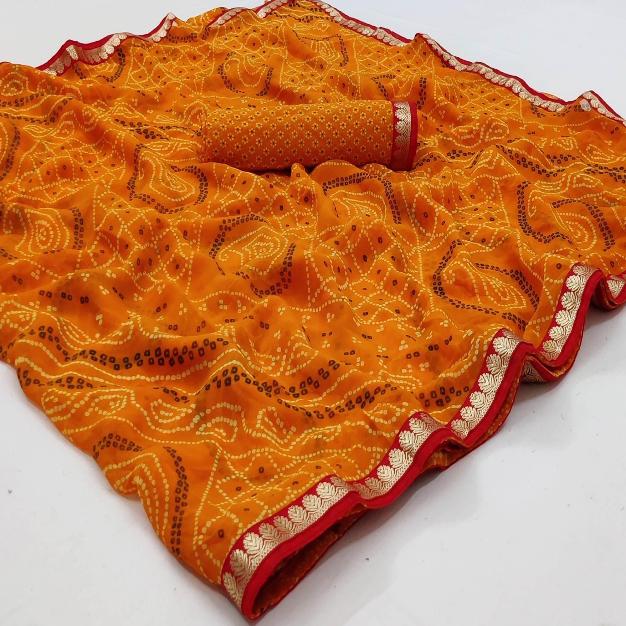 Orange Bandhani Printed Georgette Saree With Fancy Border - Peachmode