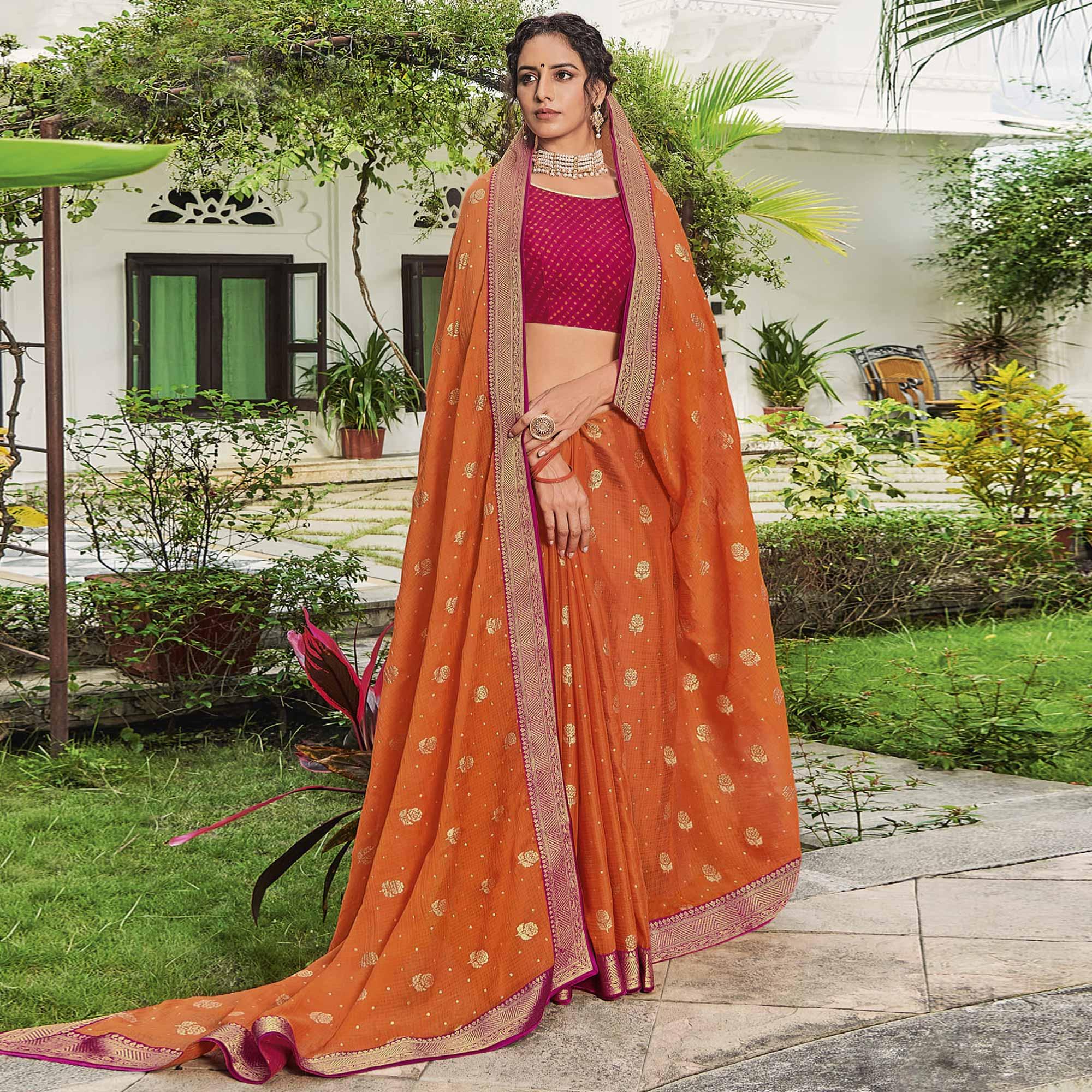 Orange Festive Wear Woven & Embelllished Chiffon Saree - Peachmode