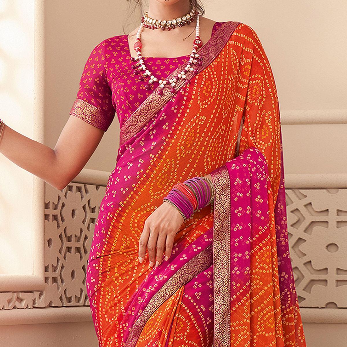 Orange-Pink Casual Wear Bandhani Printed Chiffon Saree With Tassels - Peachmode