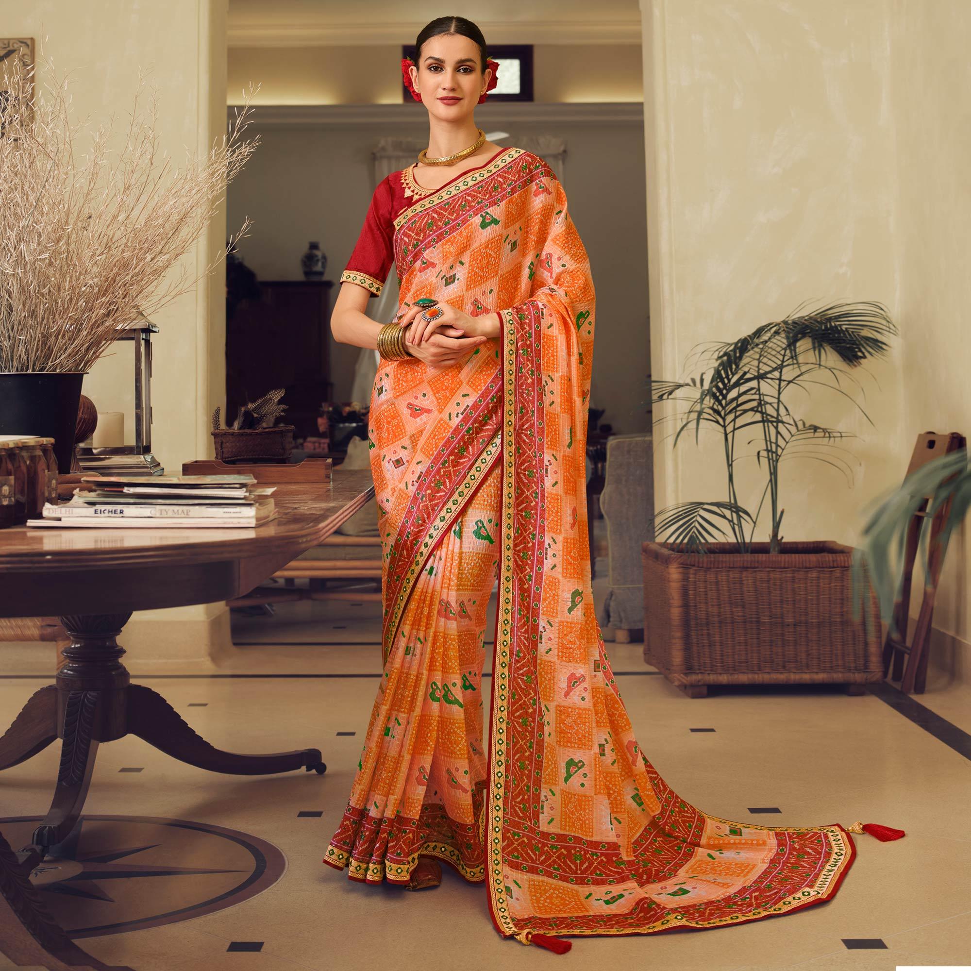 Orange Printed With Embellished Chiffon Saree With Tassels - Peachmode