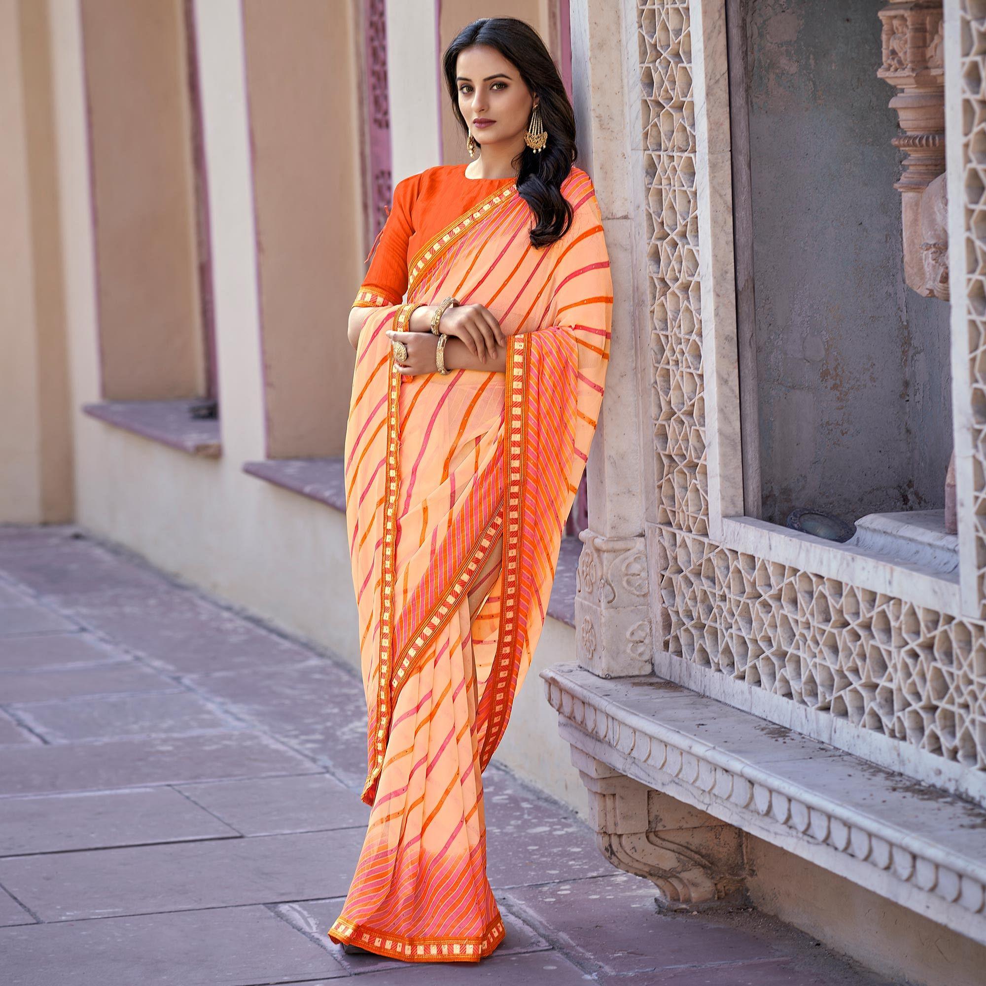 Orange Printed With Embellished Georgette Saree - Peachmode