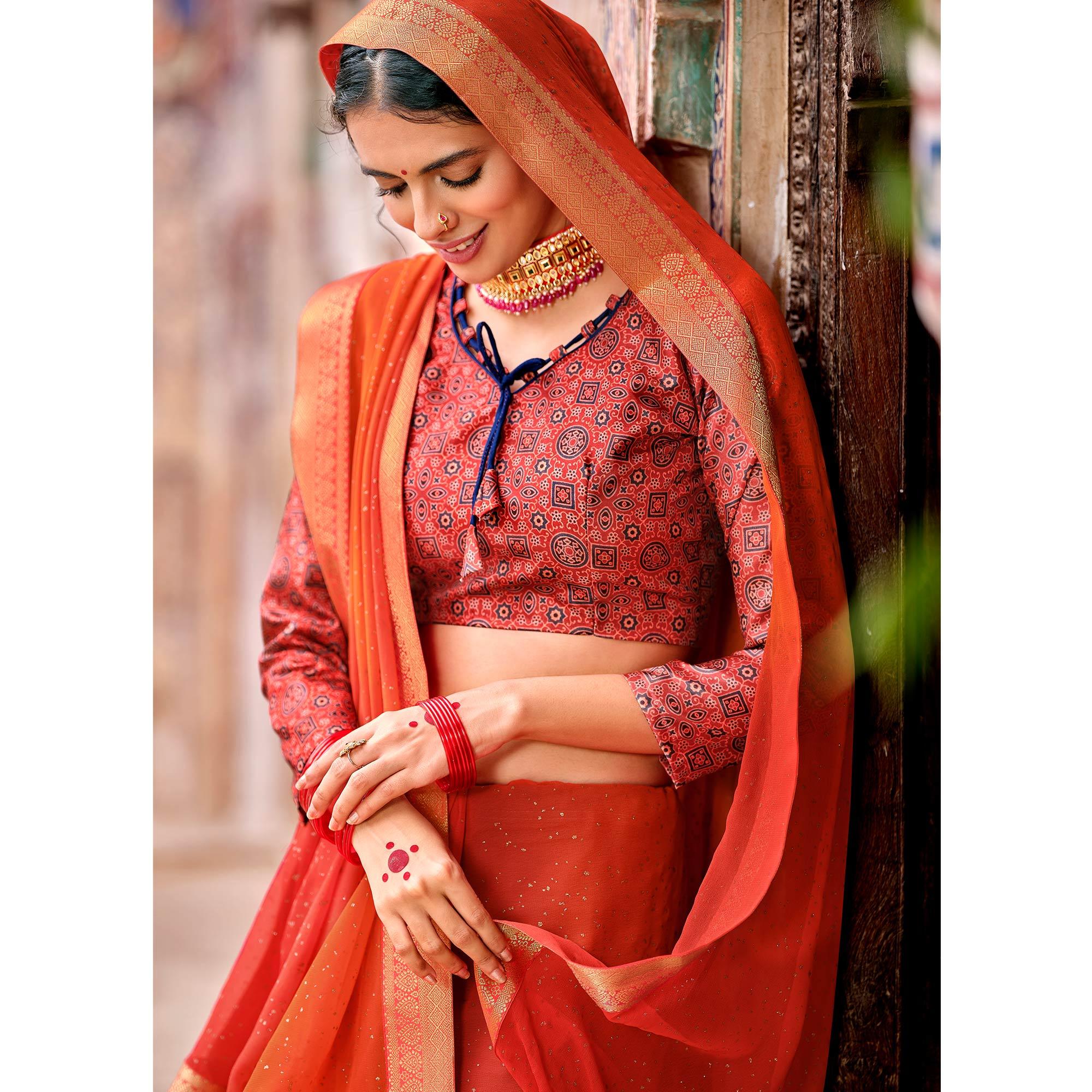 Orange-Red Partywear Printed Georgette Saree With Gold Zari - Peachmode