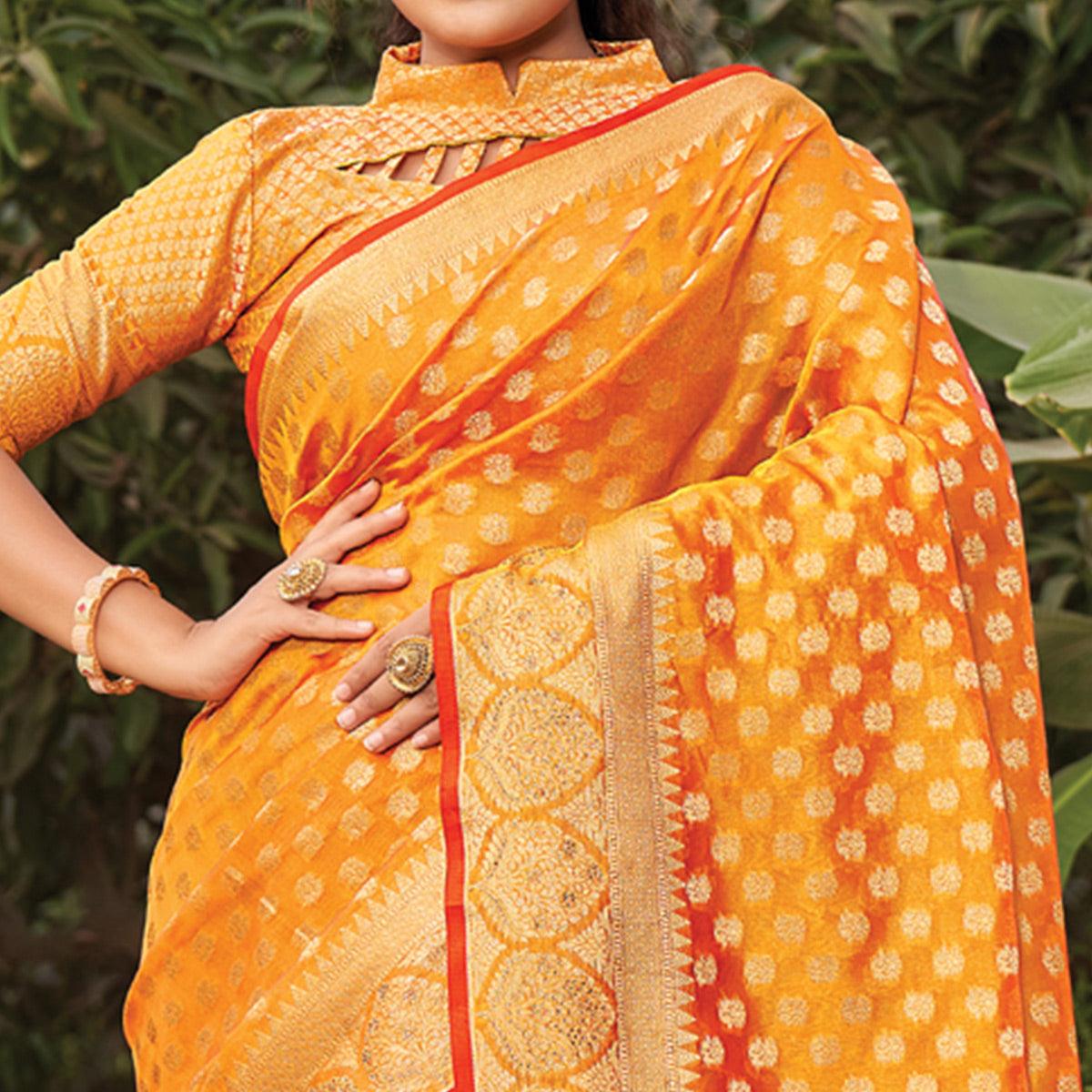 Orange Woven Organza Saree with Tassels - Peachmode