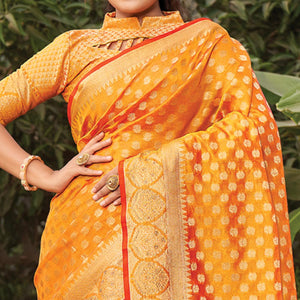 Orange Woven Organza Saree with Tassels - Peachmode