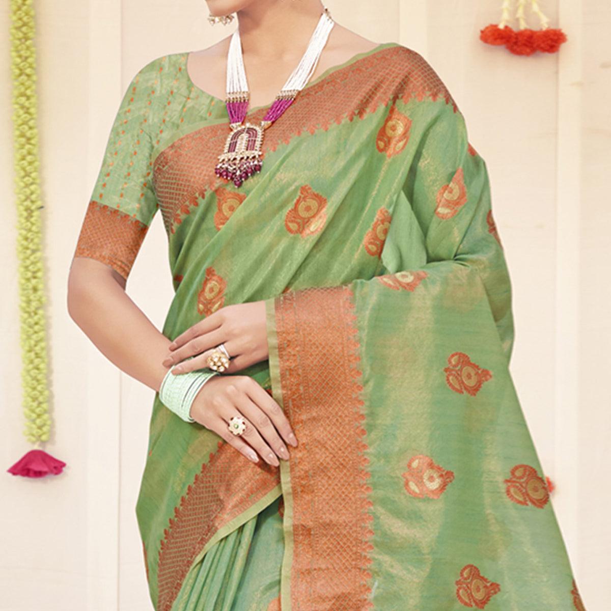 Pista Green Woven Organza Saree With Tassels - Peachmode