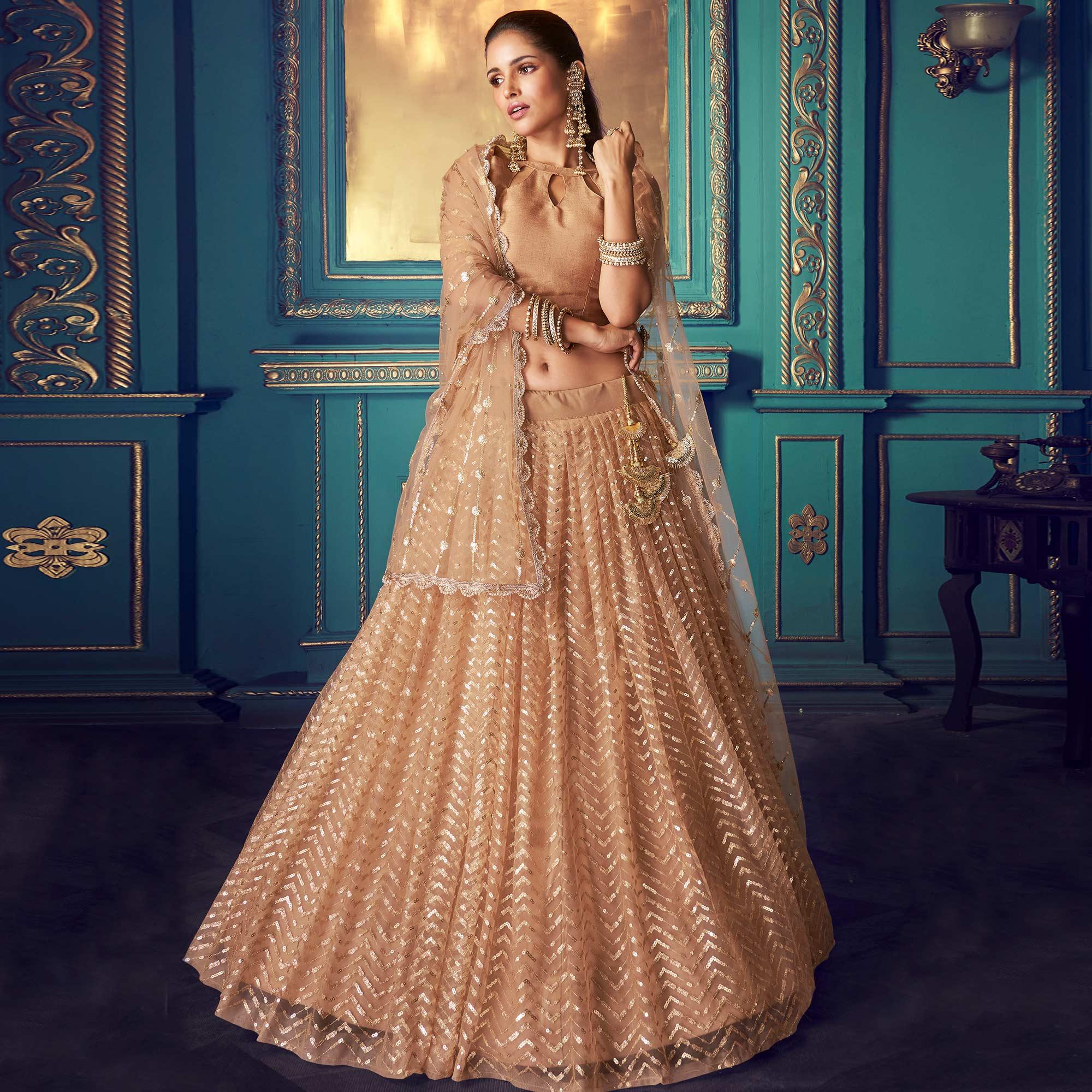 Pleasance Beige Colored Partywear Embroidered Soft Net Lehenga Choli - Peachmode
