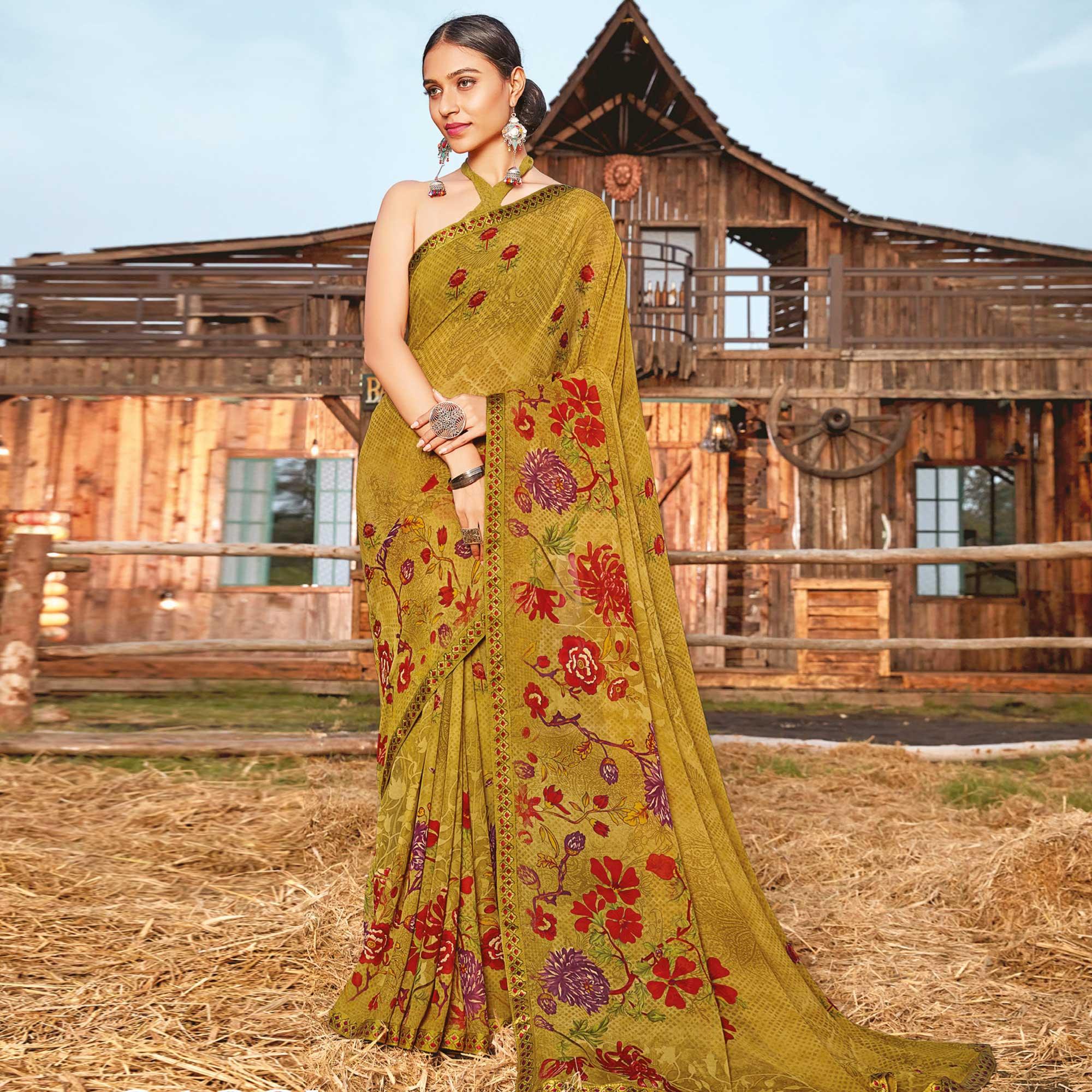 Pleasance Chikoo Coloured Partywear Pure Georgette Floral Printed Saree With Fancy Lace Border - Peachmode