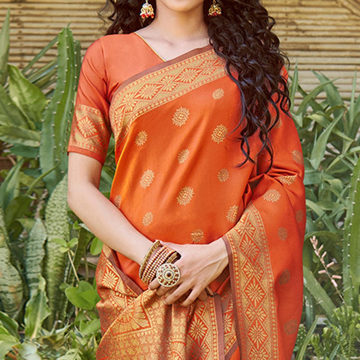 Pleasance Orange Colored Festive Wear Floral Woven Silk Blend Saree With Tassels - Peachmode