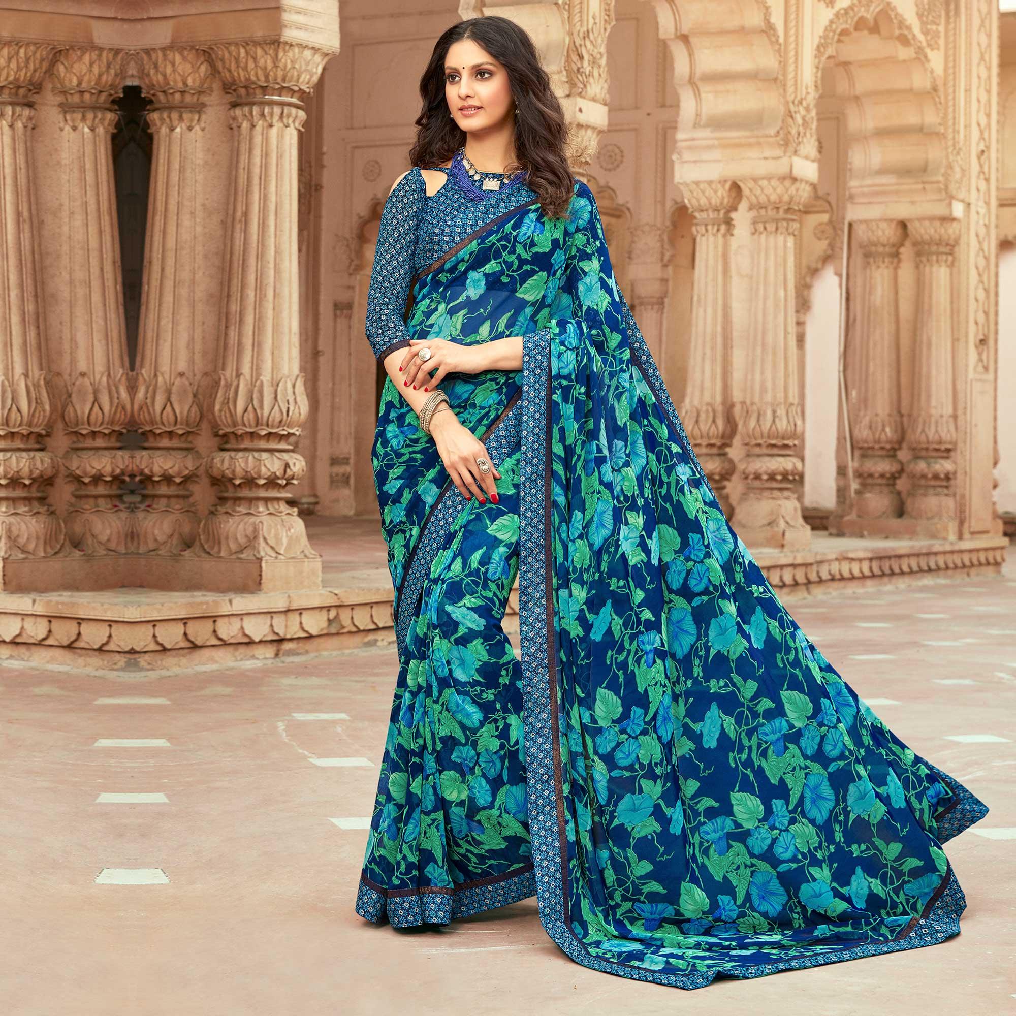 Prominent Blue Colored Casual Floral Printed Georgette Saree - Peachmode