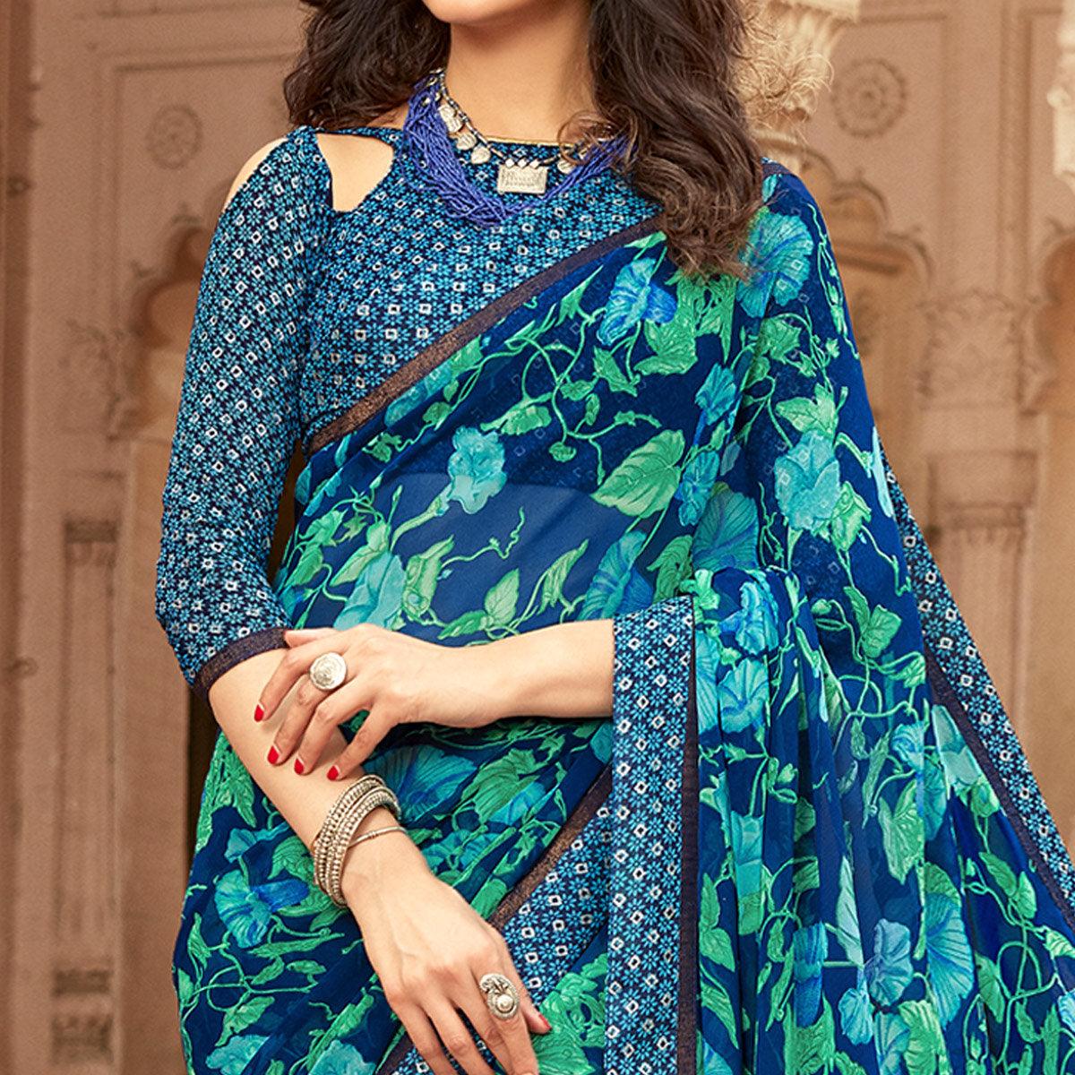 Prominent Blue Colored Casual Floral Printed Georgette Saree - Peachmode