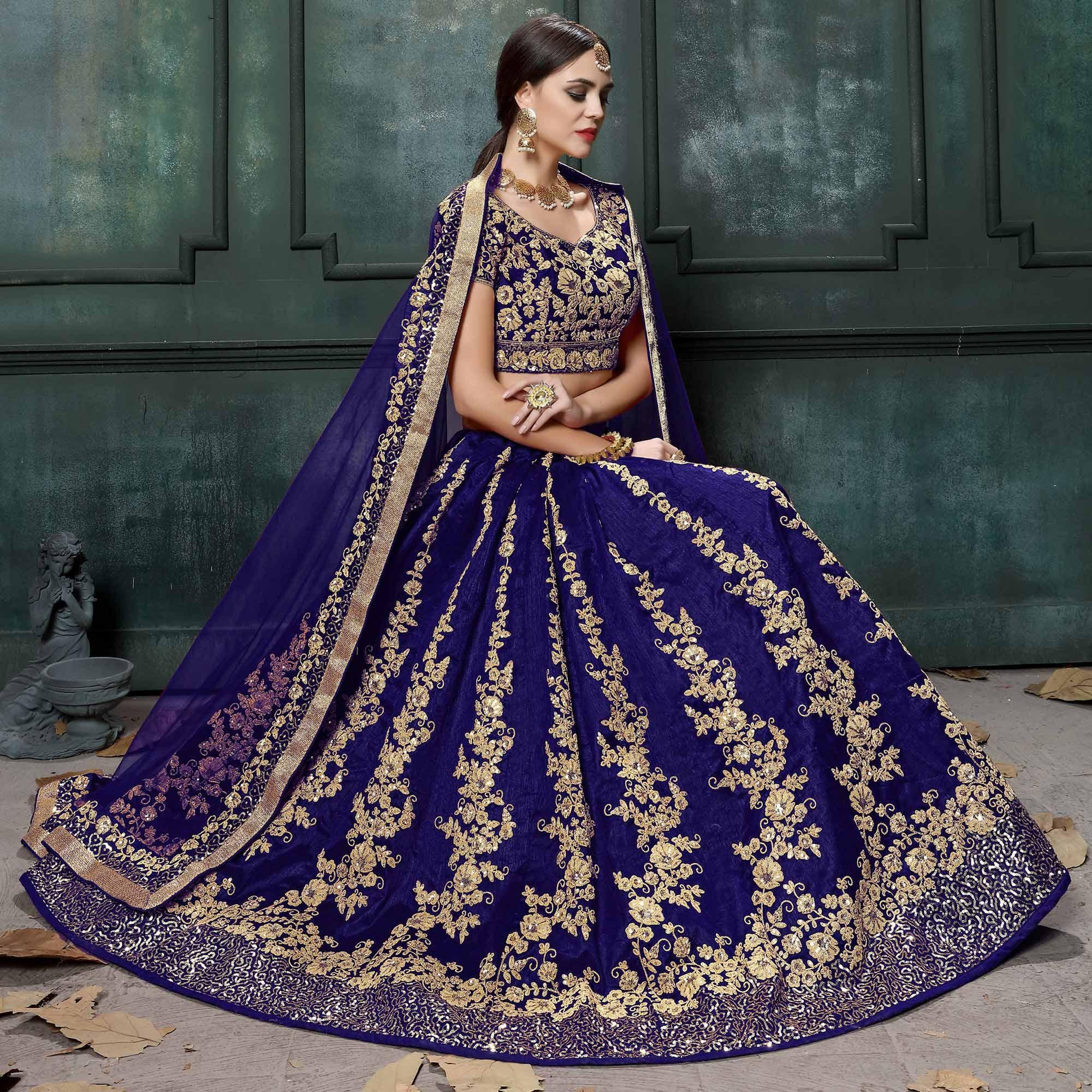 Prominent Blue Colored Wedding Wear Embroidered Raw Silk Lehenga - Peachmode