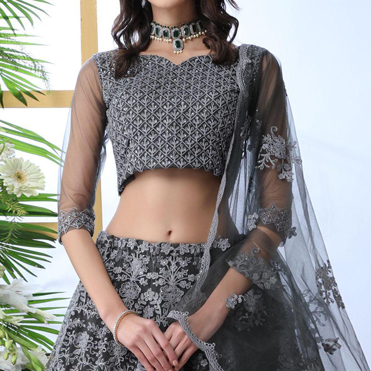 Prominent Grey Colored Partywear Embroidered Netted Lehenga Choli - Peachmode