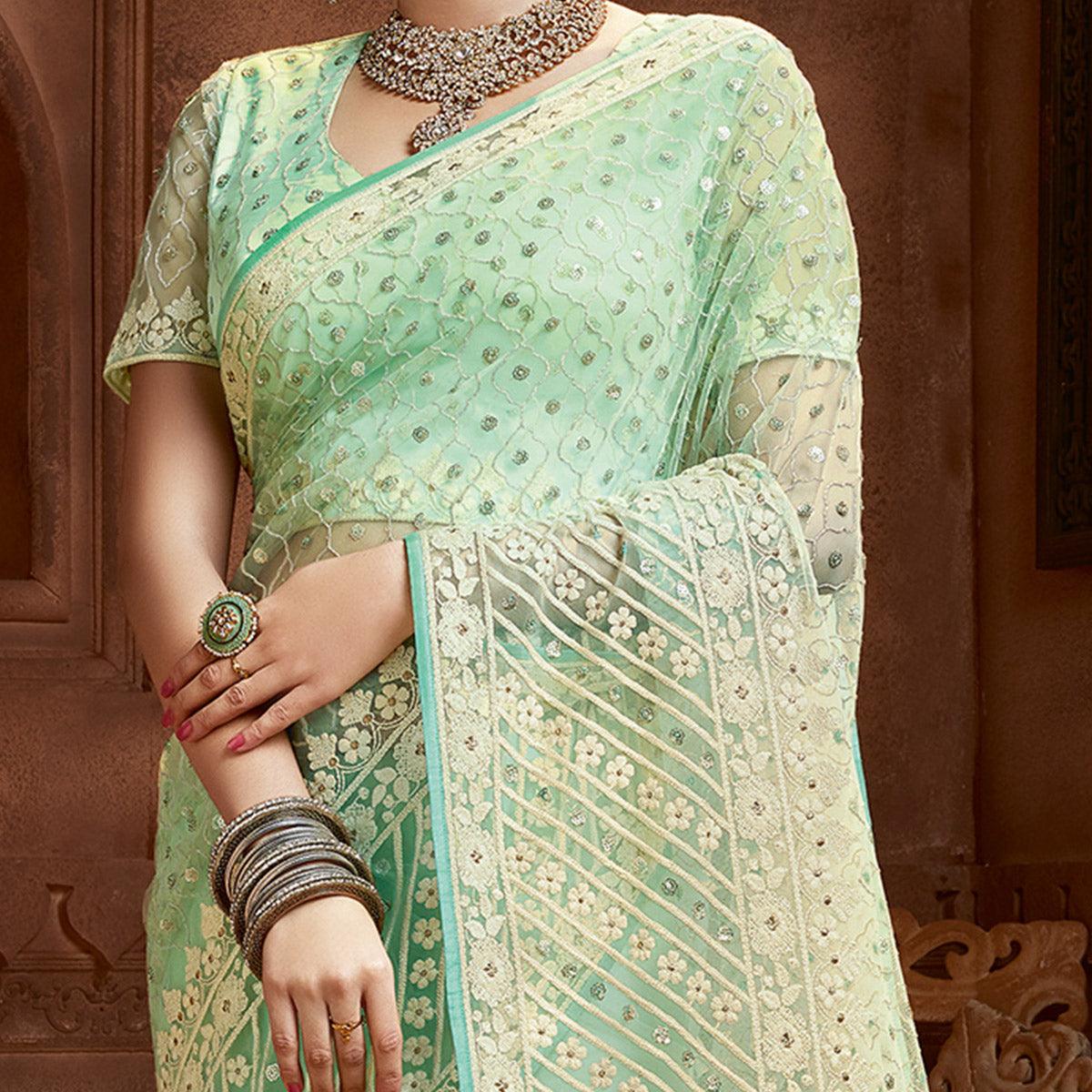 Prominent Mint Green Coloured Partywear Embroidered Soft Net Saree - Peachmode