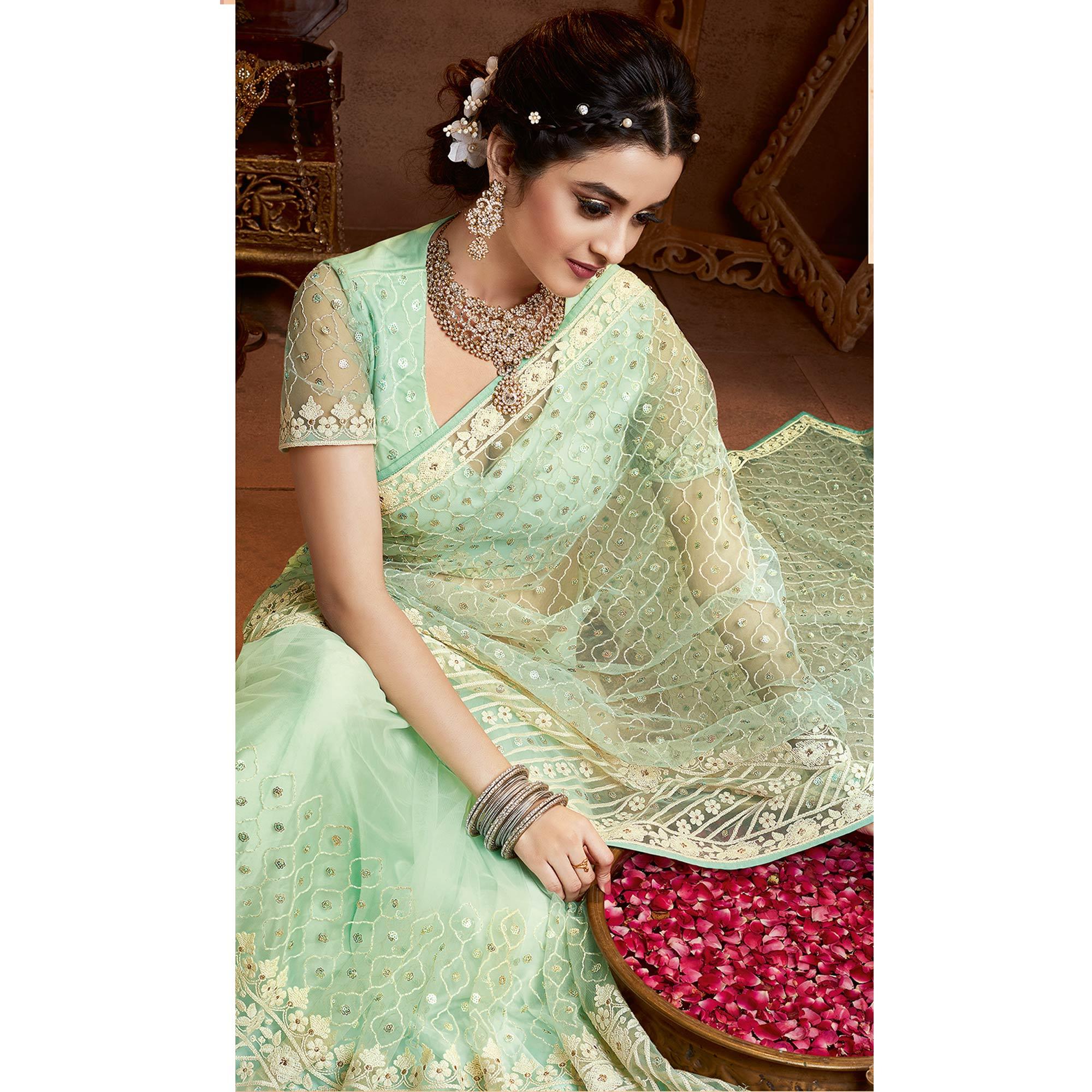 Prominent Mint Green Coloured Partywear Embroidered Soft Net Saree - Peachmode