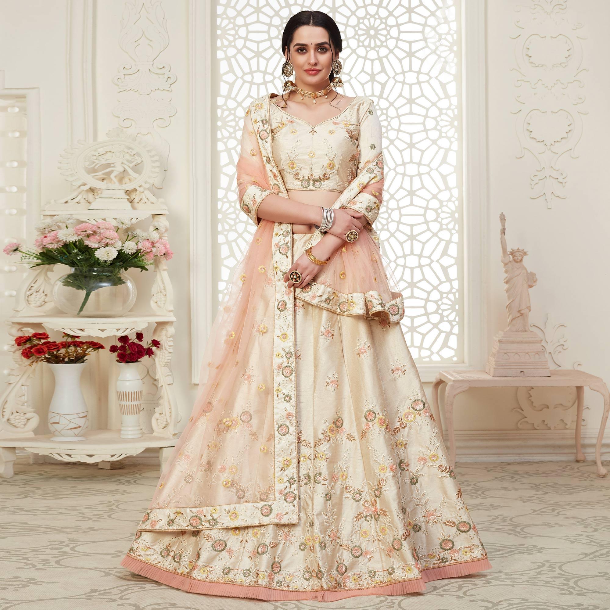 Ravishing Cream Colored Cording Thread & Sequence Embroidery Designer Wedding Wear Net With Mulberry Silk Lehenga Choli - Peachmode