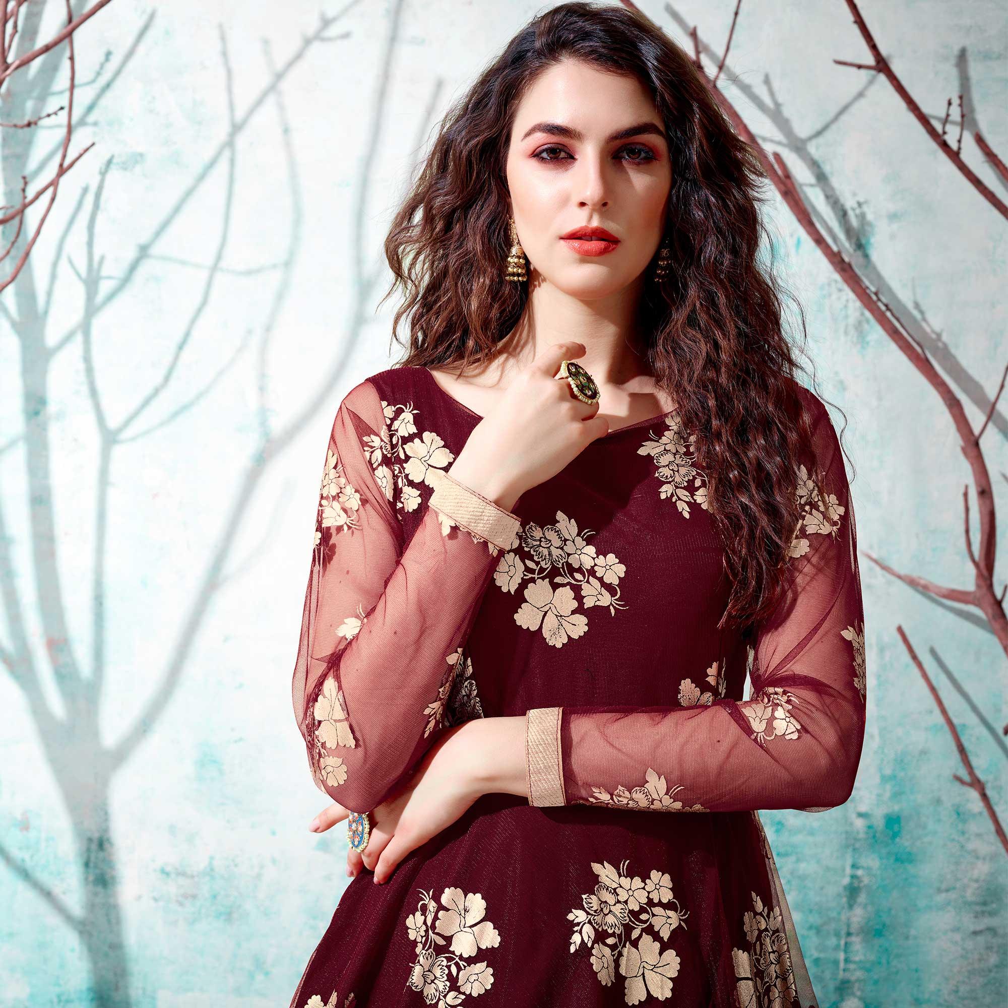 Ravishing Maroon Coloured Partywear Metallic Foil Work Net Gown - Peachmode