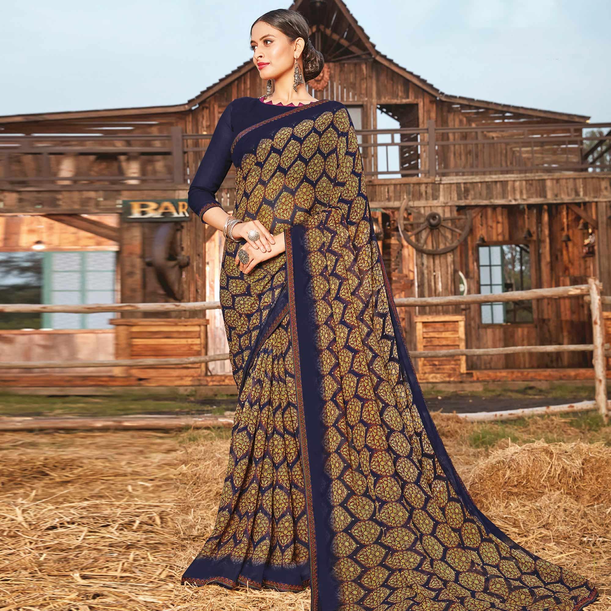 Ravishing Navy Blue Coloured Partywear Pure Georgette Floral Printed Saree With Fancy Lace Border - Peachmode