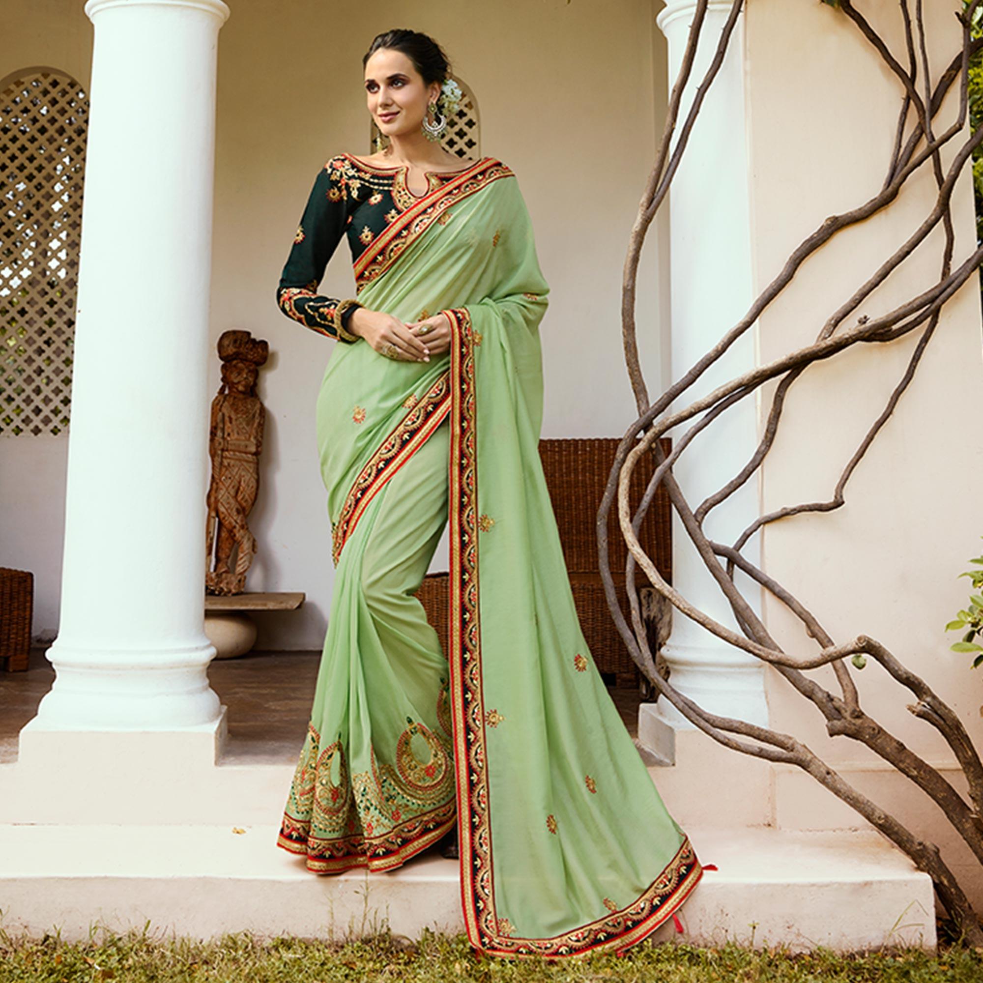 Refreshing Pale Green Colored Partywear Embroidered Silk Saree - Peachmode