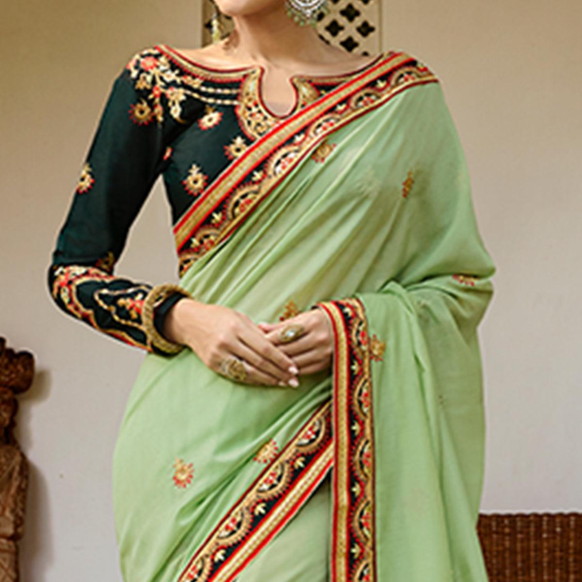 Refreshing Pale Green Colored Partywear Embroidered Silk Saree - Peachmode