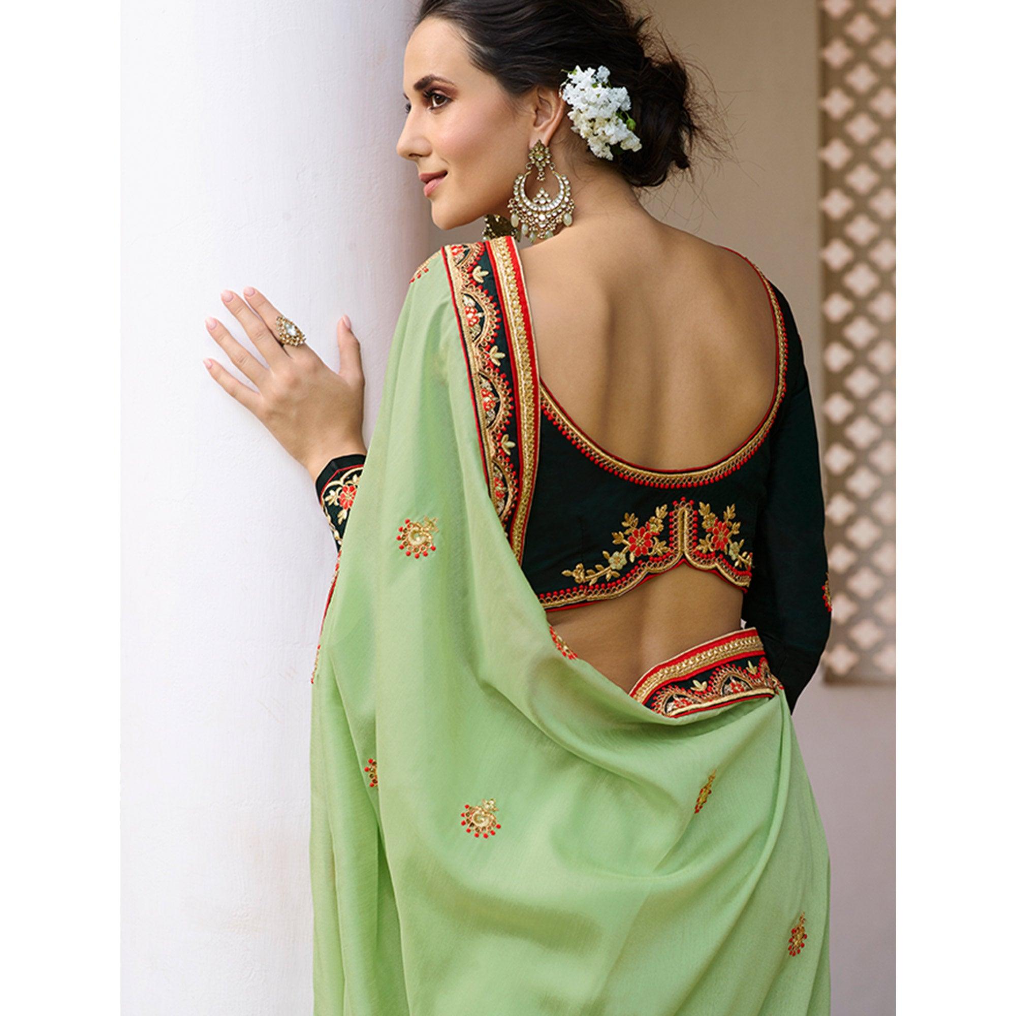 Refreshing Pale Green Colored Partywear Embroidered Silk Saree - Peachmode