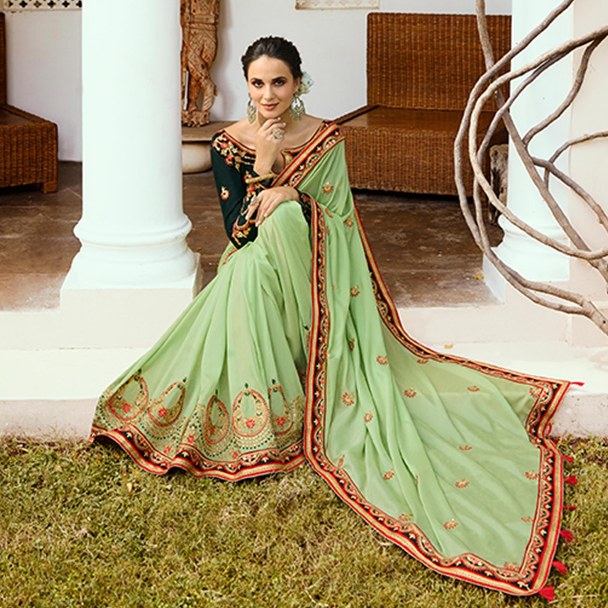 Refreshing Pale Green Colored Partywear Embroidered Silk Saree - Peachmode