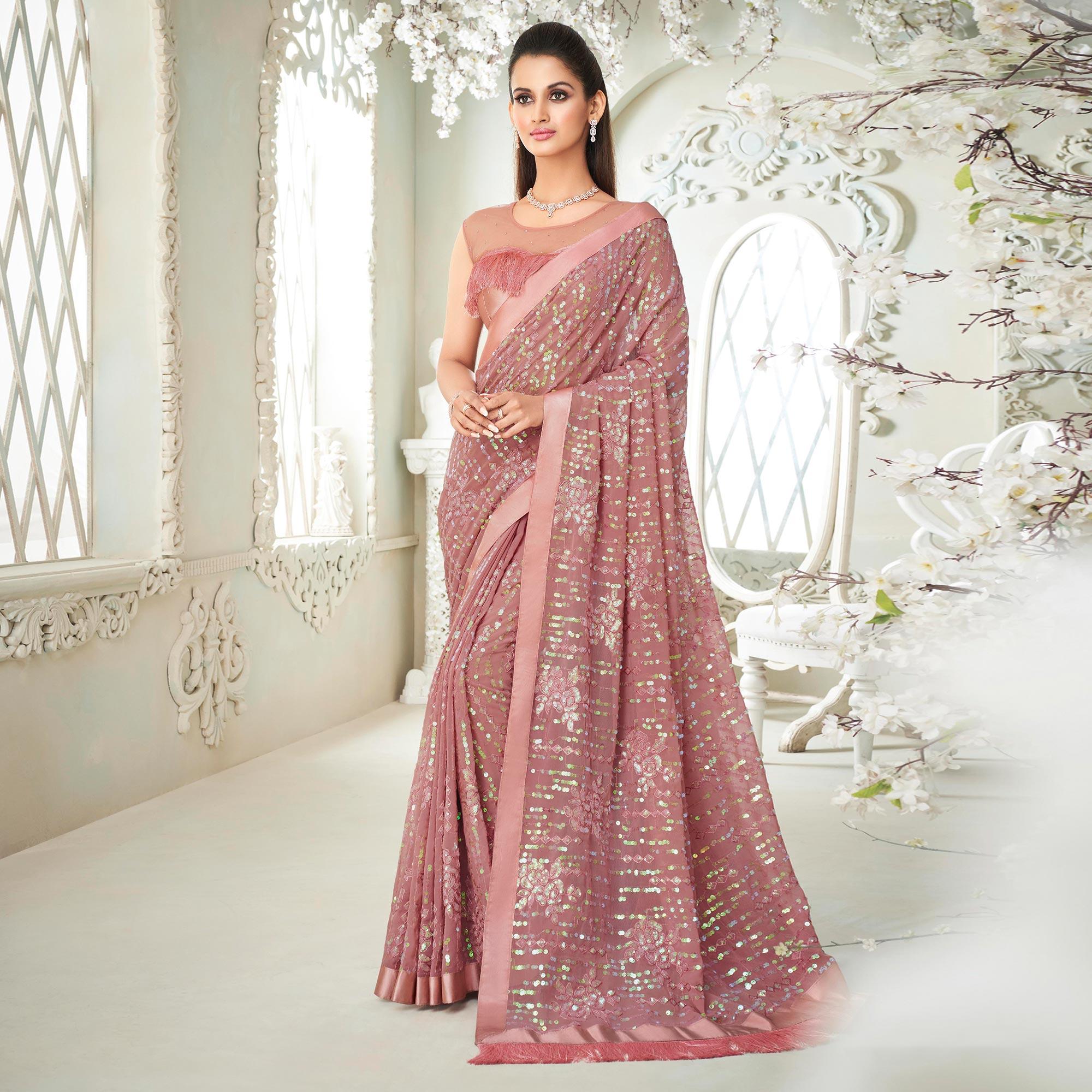 Salmon Pink Sequence Embroidered Georgette Saree With Tassels - Peachmode