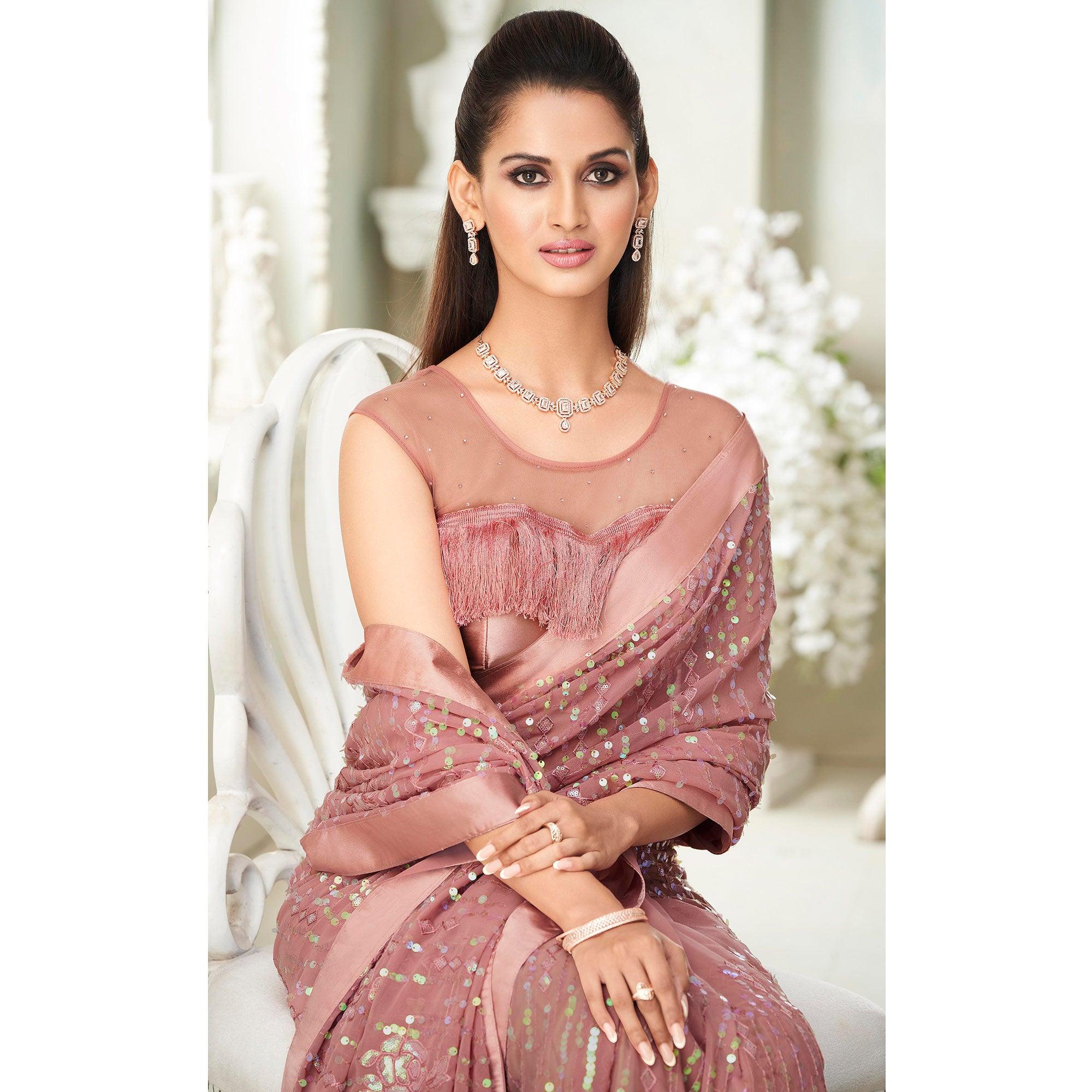 Salmon Pink Sequence Embroidered Georgette Saree With Tassels - Peachmode